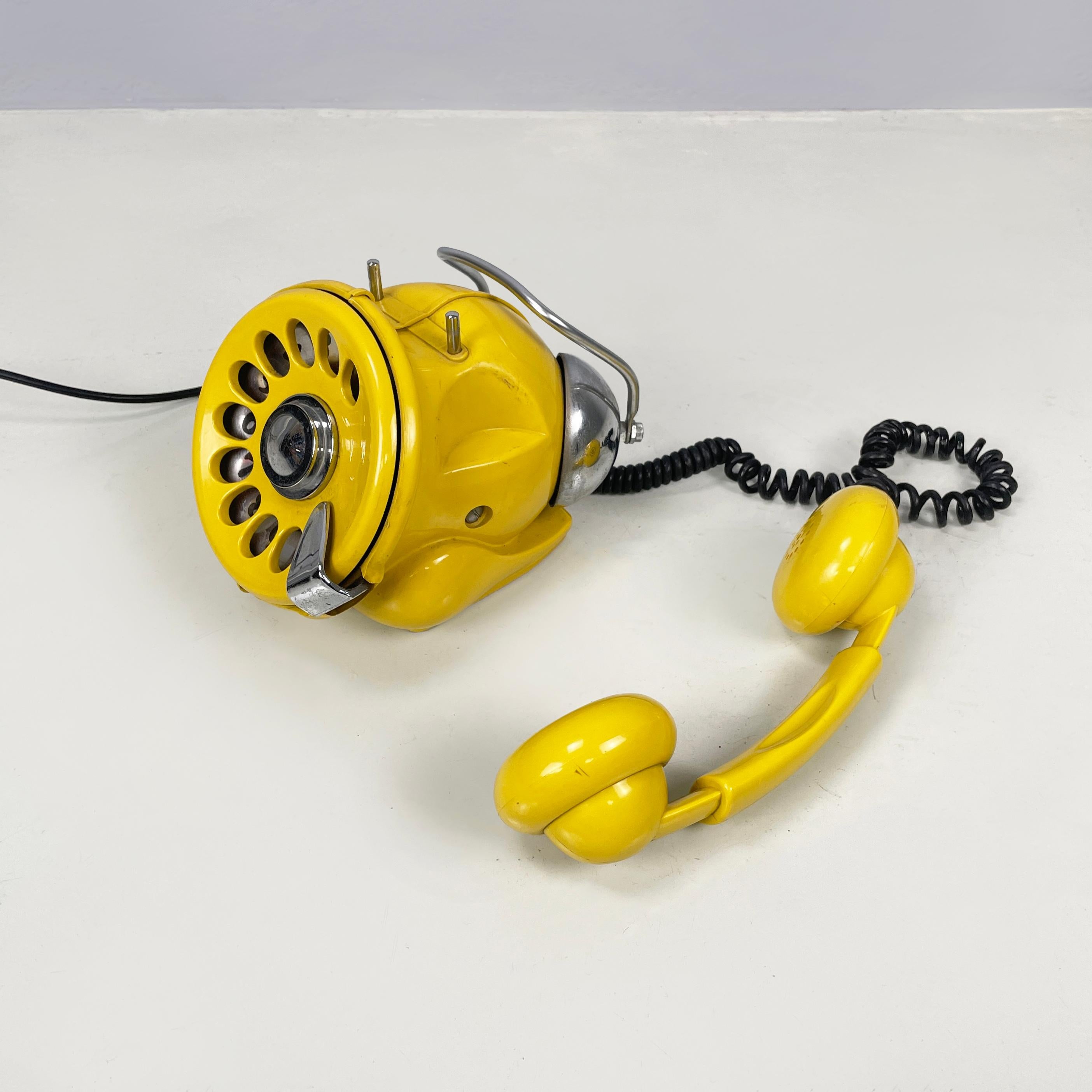 Italian space age Table dial telephone Bobo by Sergio Todeschini for Telcer, 1970s
Table dial telephone mod. Bobo made of bright yellow plastic and metal. In the upper part there is the handset with rounded microphone and receivers, in yellow