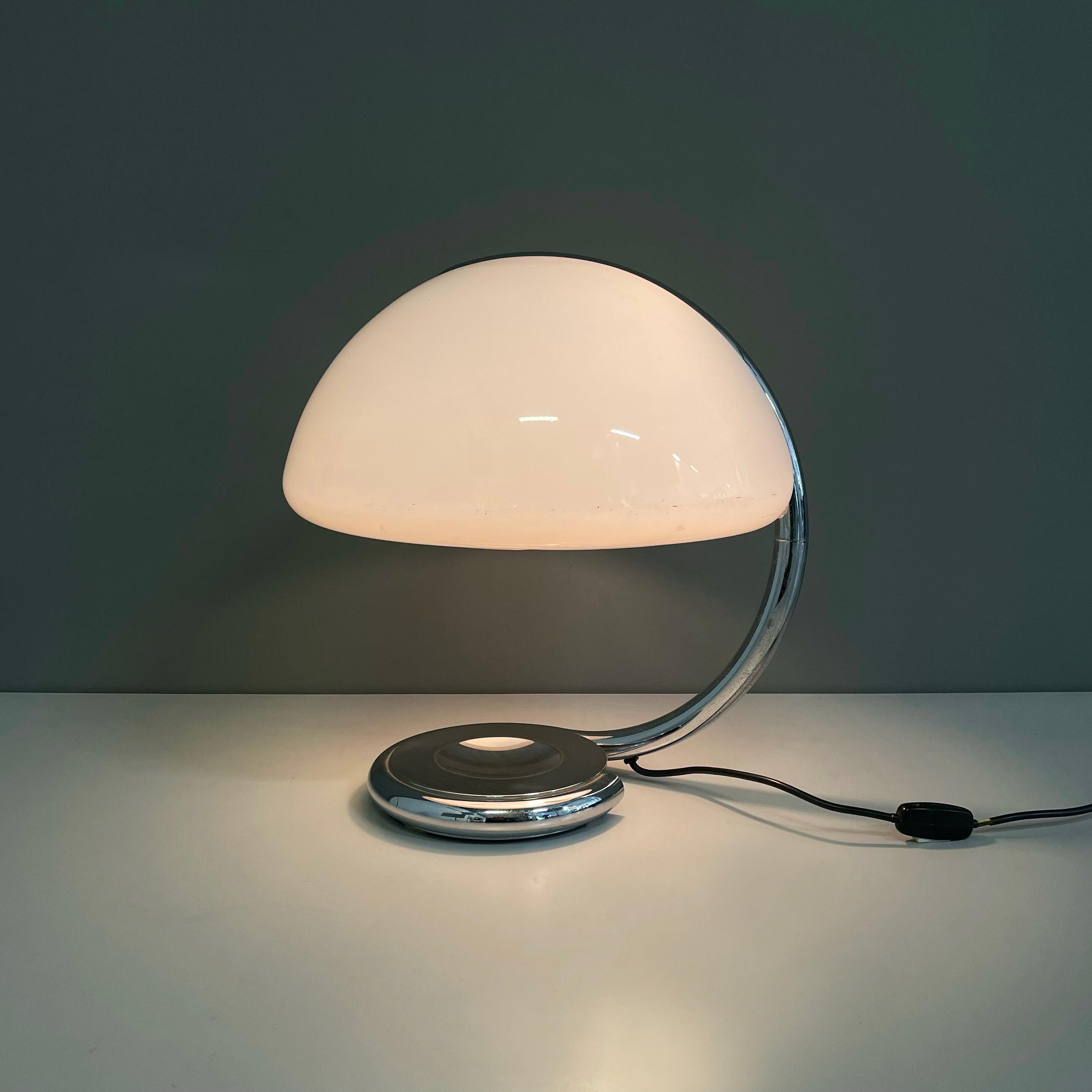 Italian space age Table lamp Serpente by Elio Martinelli for Martinelli Luce, 1970s
Table lamp mod. 599 Serpente with adjustable metal tubular structure. The semi-spherical lampshade is in opaline plexiglass. The rounded structure has a pin in the