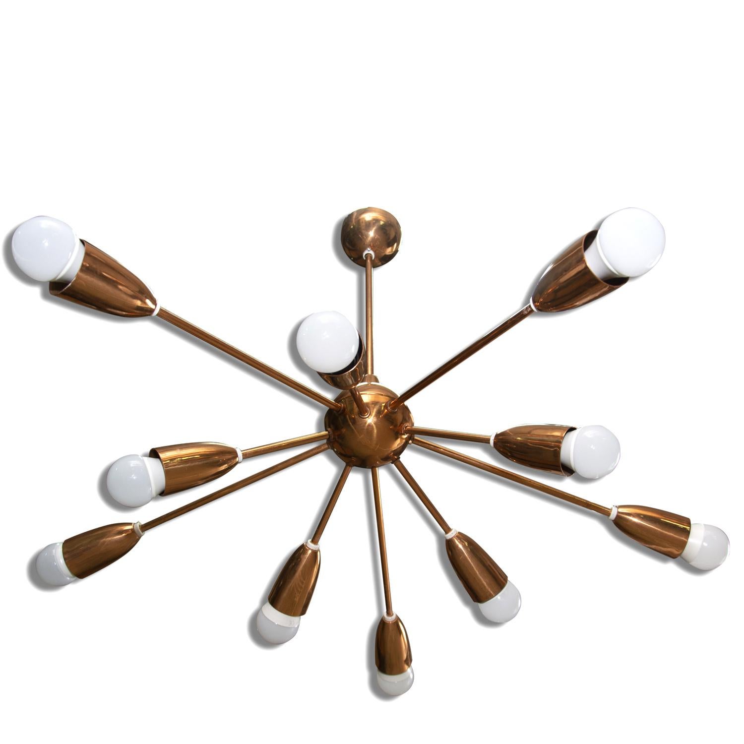 This Space Age copper Sputnik chandelier was made in Italy in the 1960s. It features 10 copper arms. The chandelier is in very good vintage condition, new wiring. 

