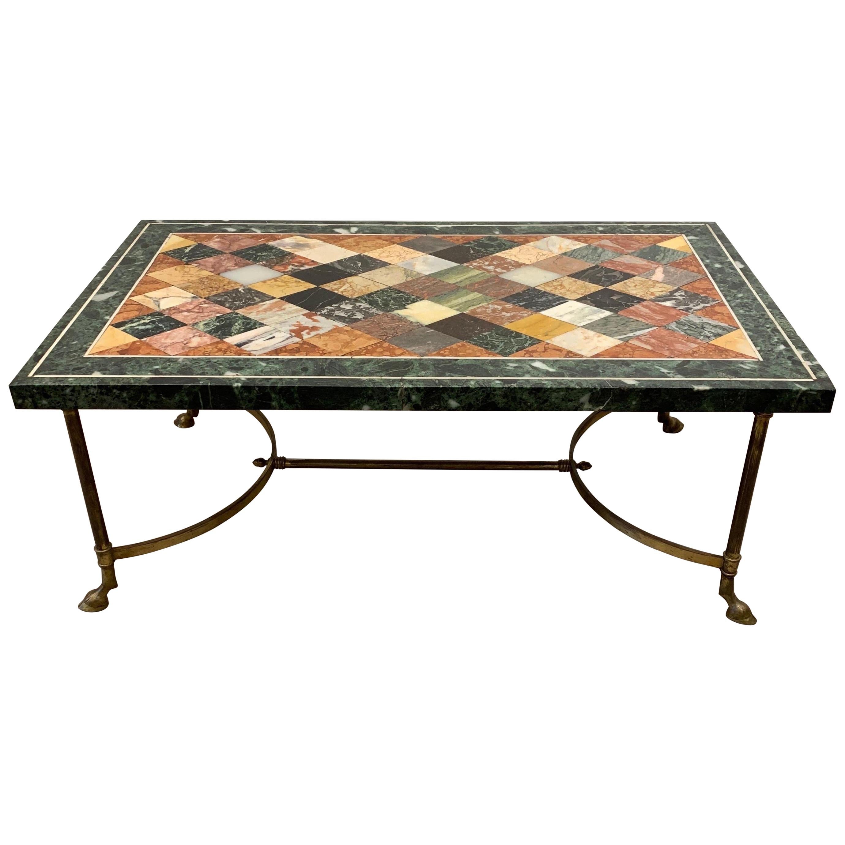 The table foot of the table is from the 1950s. It is in the style Maison Jansen. The specimen marble top is probably earlier, dating around the late 19th century or first quarter of the 20th century. The marble top has some ancient restoration and