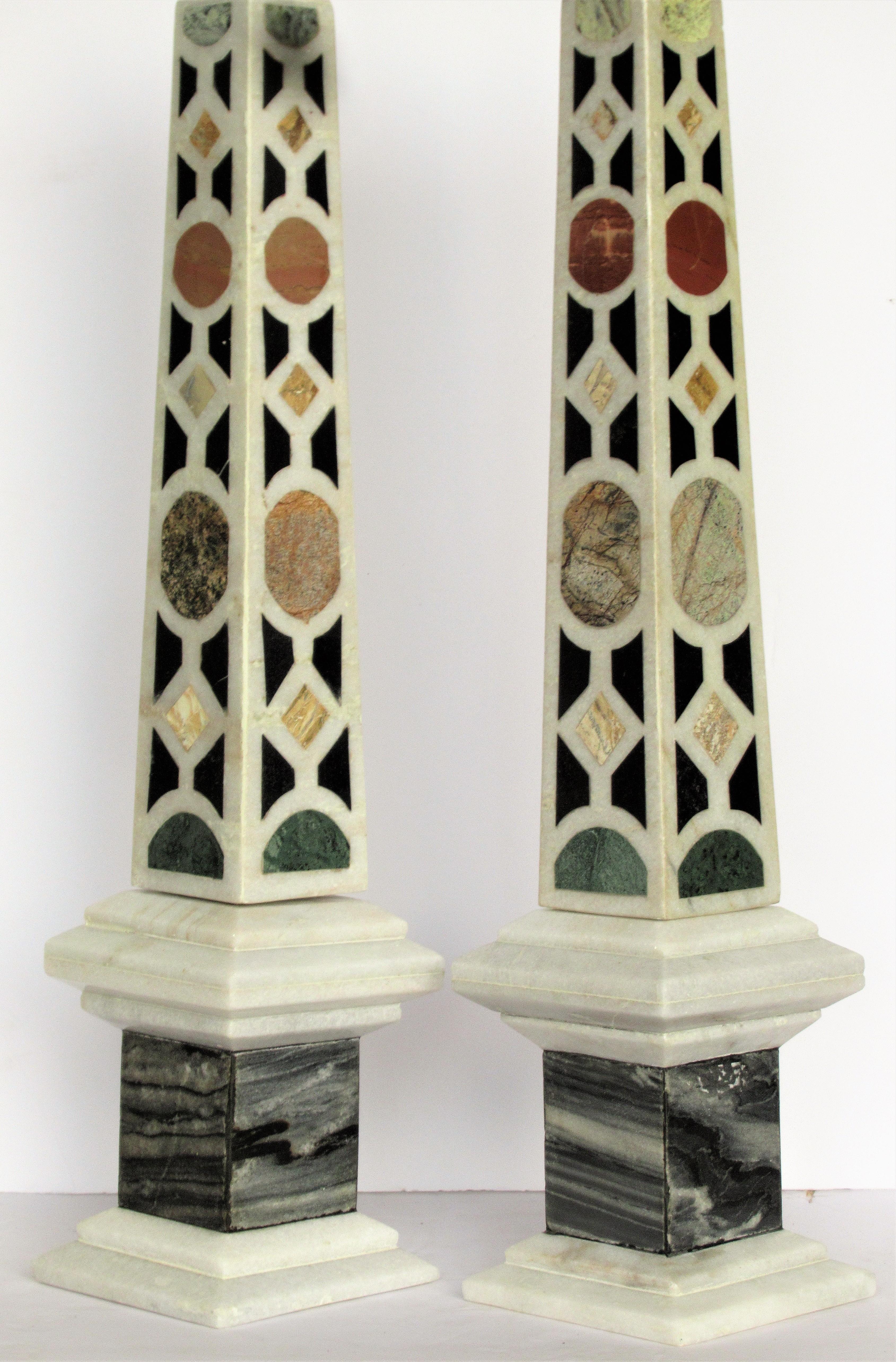 A beautiful pair of Italian specimen marble obelisks with gray and white bases and inlaid varieties of marble stone. Look at all pictures and read condition report in comment.
