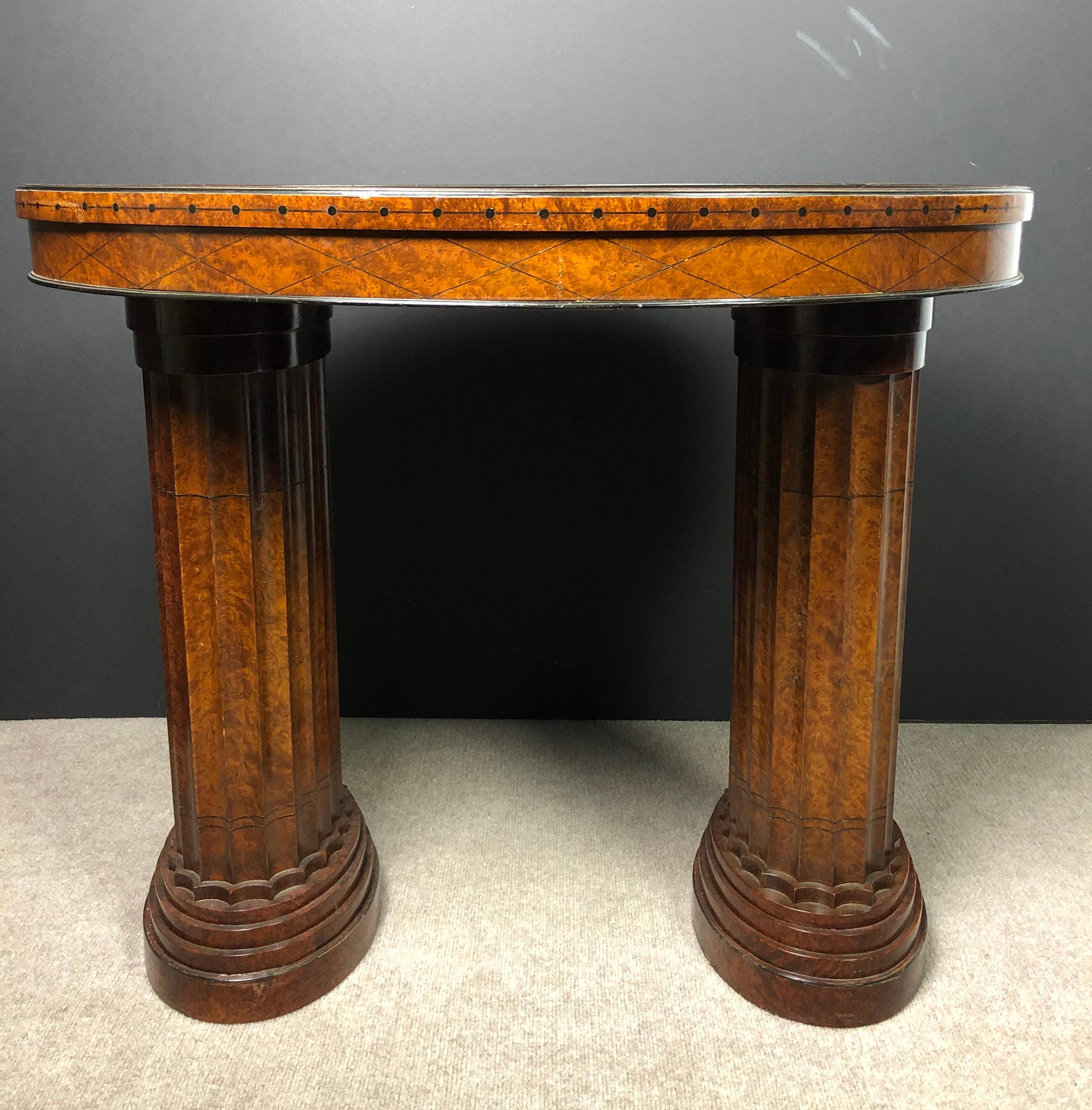 Fine quality unusual Italian multi-color specimen marble top oval pedestal center table. Red, green, yellow, black and other specimens. Art Deco style with a neoclassical influence fluted wood double pedestal base.