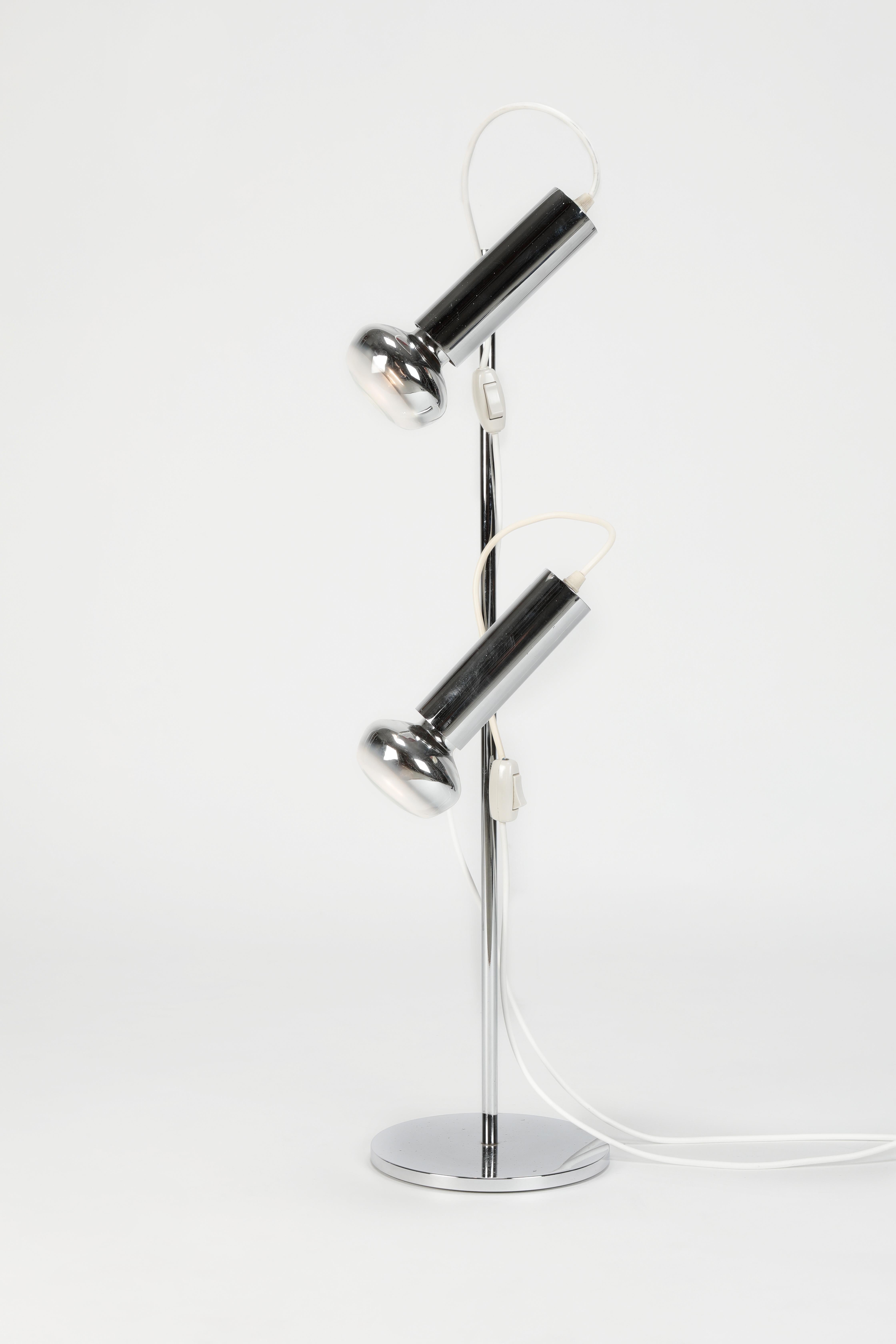 Spot table lamp manufactured in the 1970s in Italy. Chrome steel floor lamp with two adjustable spots.