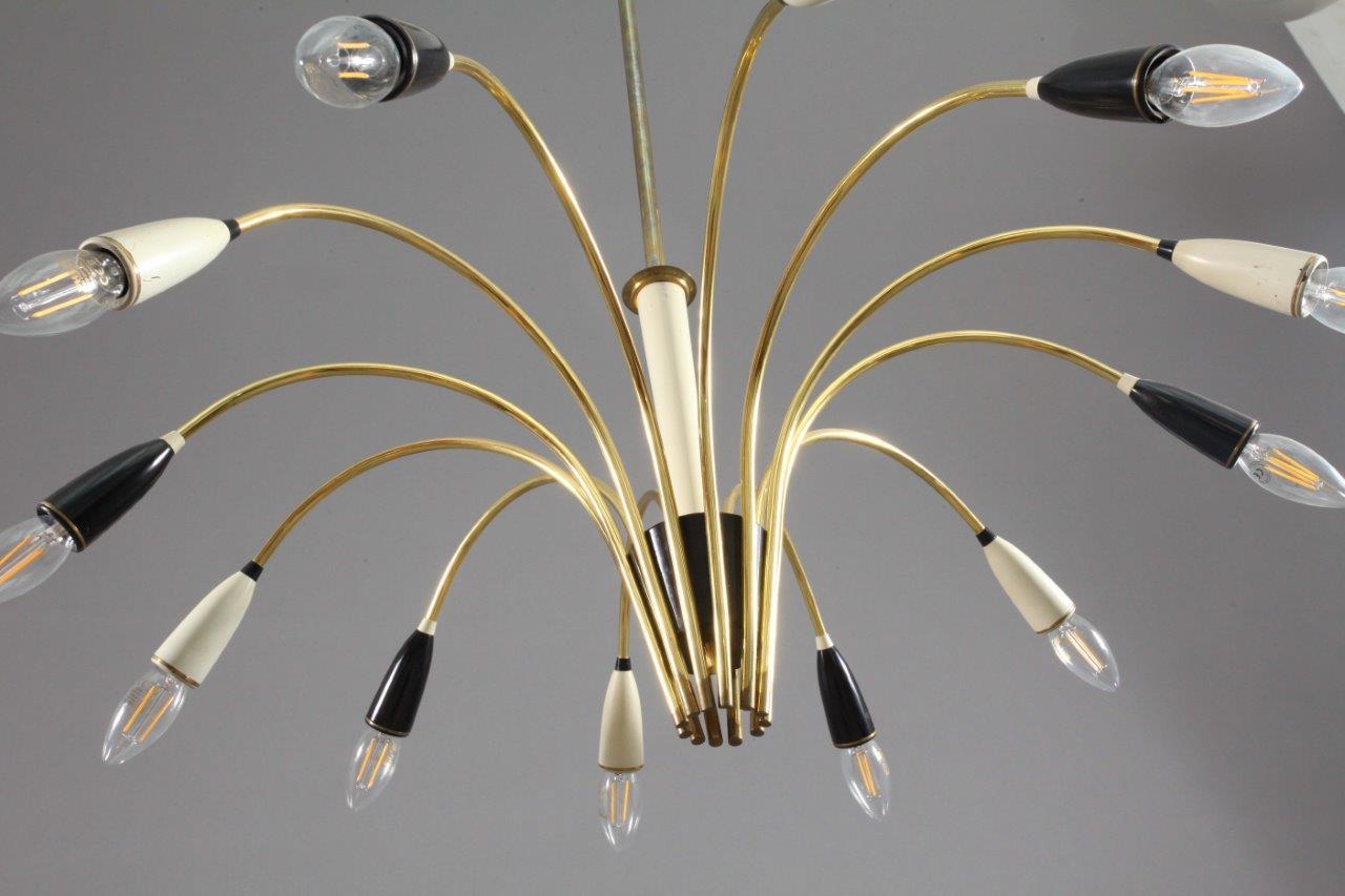 Sputnik chandelier,
Italy 1950,
Arredoluce.
Brass with two-tone cones
Please note that we can provide you with different sizes/length of stems or even switch to a chain, according to your requirement.