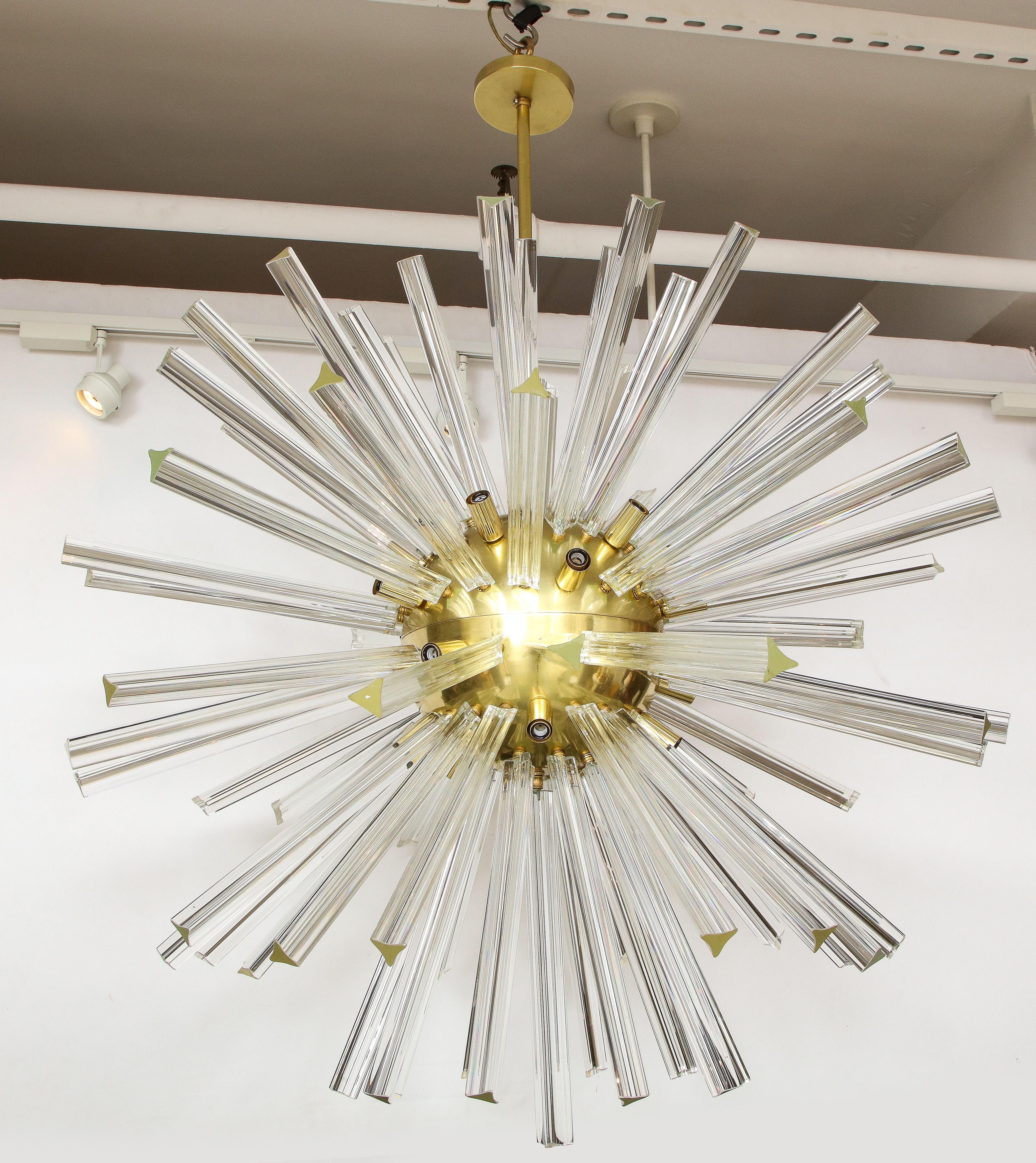 This Italian beauty has real star power. This spectacular piece consists of clear triedri (three-sided) clear crystals in varying lengths extending from a center globe. Newly re-wired.