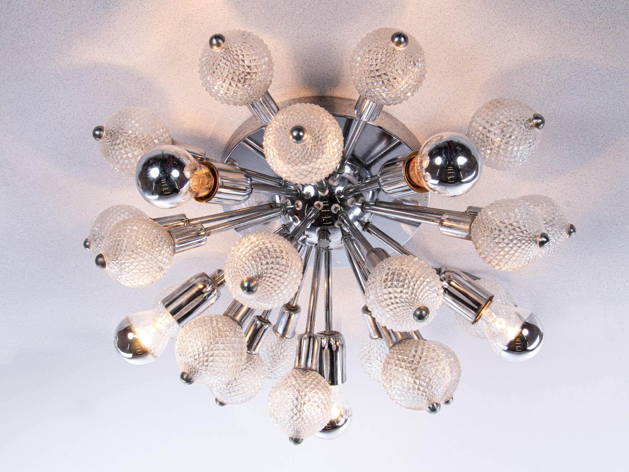 Elegant sputnik ceiling lamp with crystal glass balls on a chromed frame. Chandelier has a modernist look and makes a great light. Manufactured in Italy, 1960s. 

Model: sputnik, starburst. 
Style: mid century modern, space age. 
Measures: height