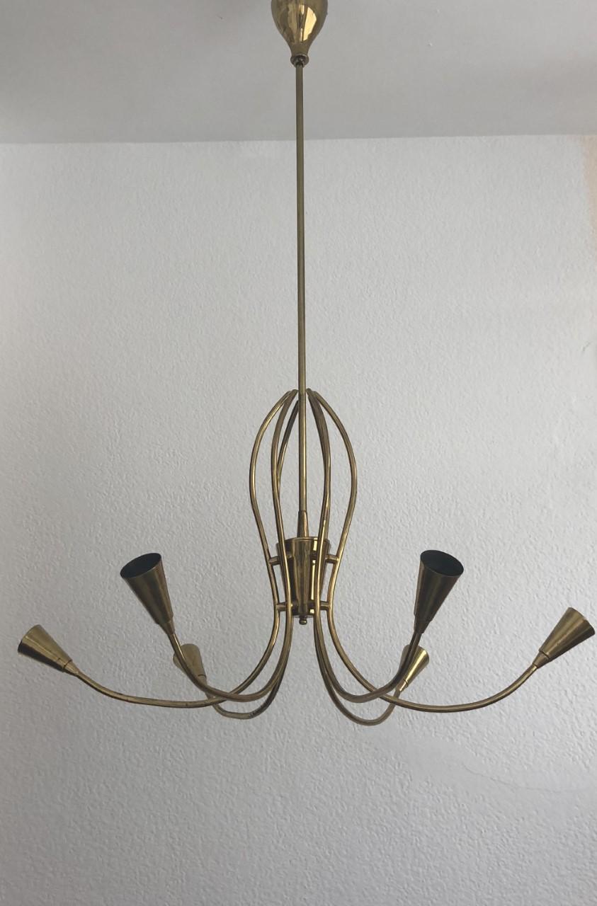 Beautiful and elegant Sputnik Italian midcentury chandelier from 1960s. This chandelier was made during the 1960s in Italy.
This chandelier is equipped with 6 light socket (E14). A professional electrician has checked and prepared the piece to