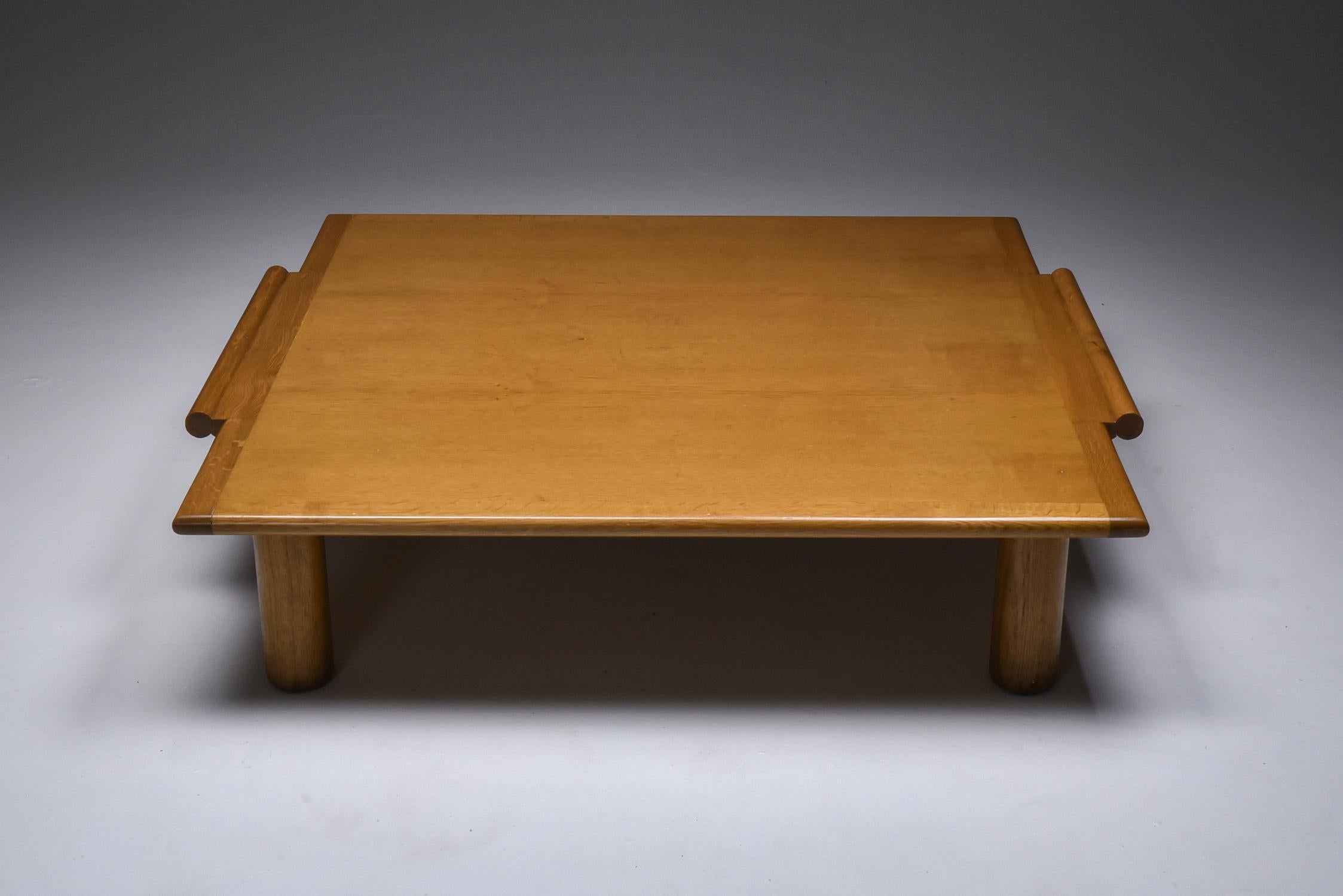 Minimalist coffee table in oak, Italy, 1970s

would fit well in a rustic modern, zen wabi sabi interior
A nice detail are the two handles on the side of the top, these give you the impression the table is like a tray you can lift up and take