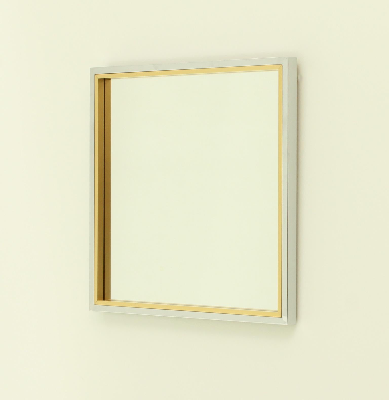 Italian square wall mirror from 1970's. Double frame in chromed metal and brass with square mirror glass.