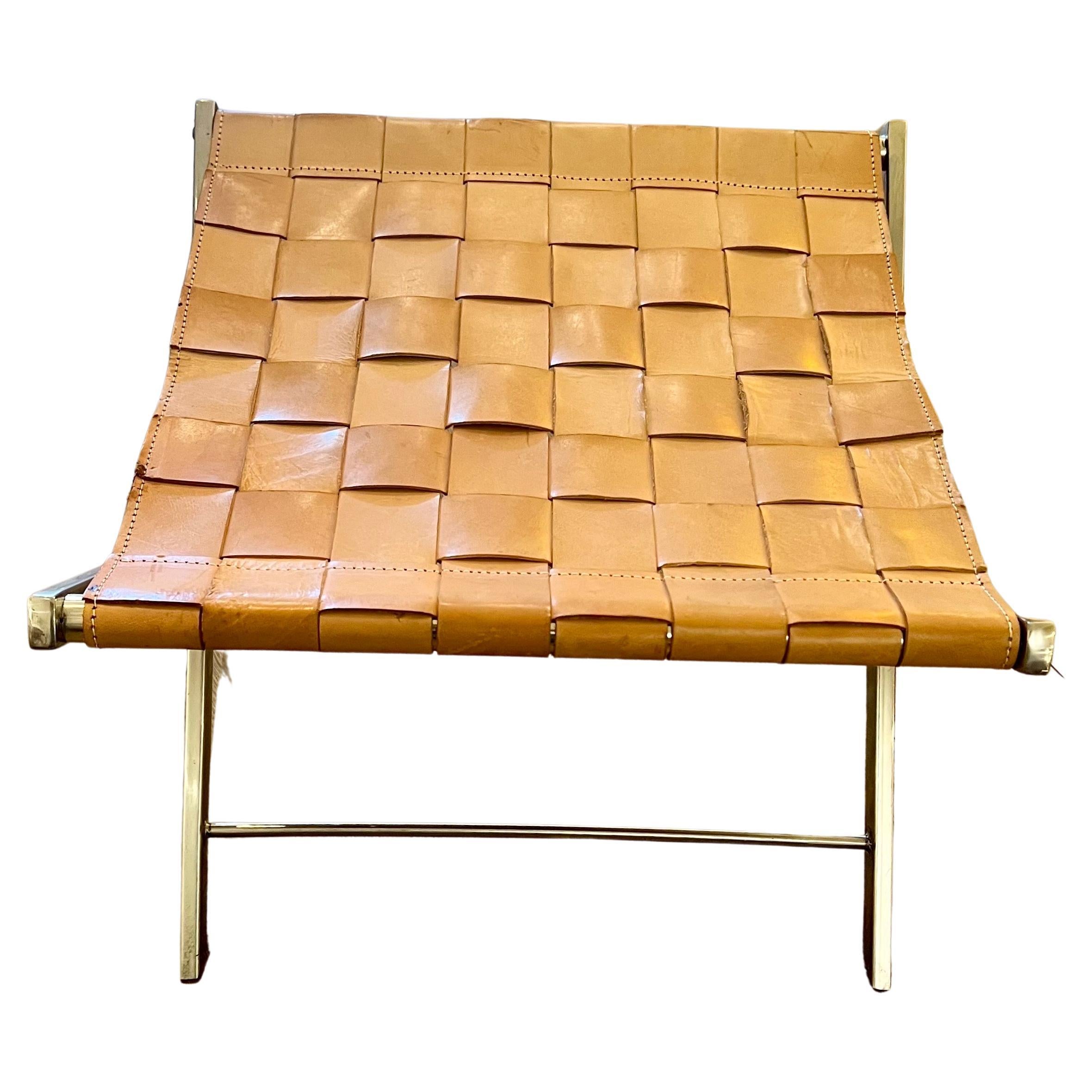 Versatile leather straps with polished stainless steel base , folding stool circa 1980's very nice condition .