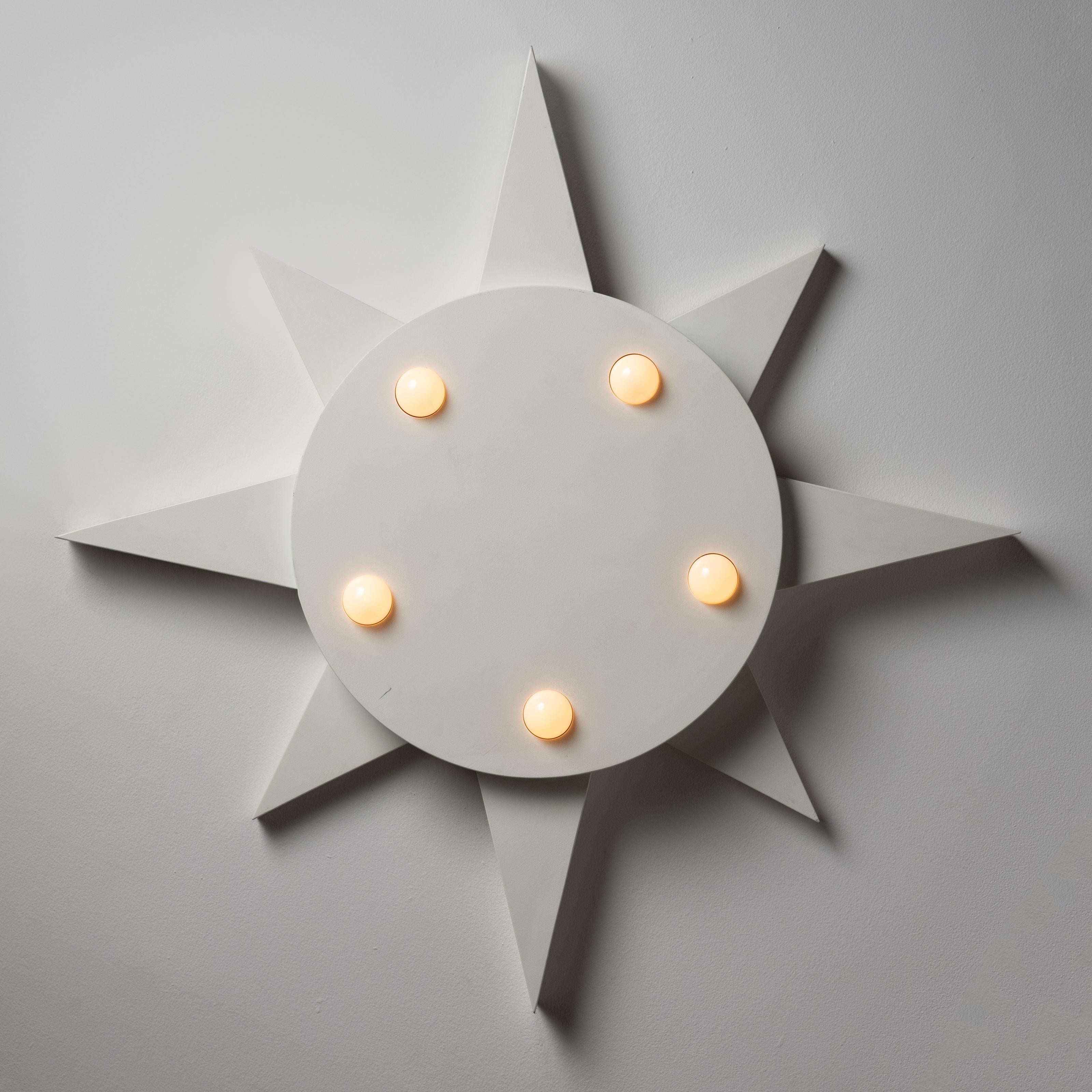 Rare Italian star lights. Designed and manufactured in Italy, circa 1970s. These star lamps are composed of metal with a matte white lacquer finish and are designed to be installed either as ceiling lamps or wall sconces. A unique playful and