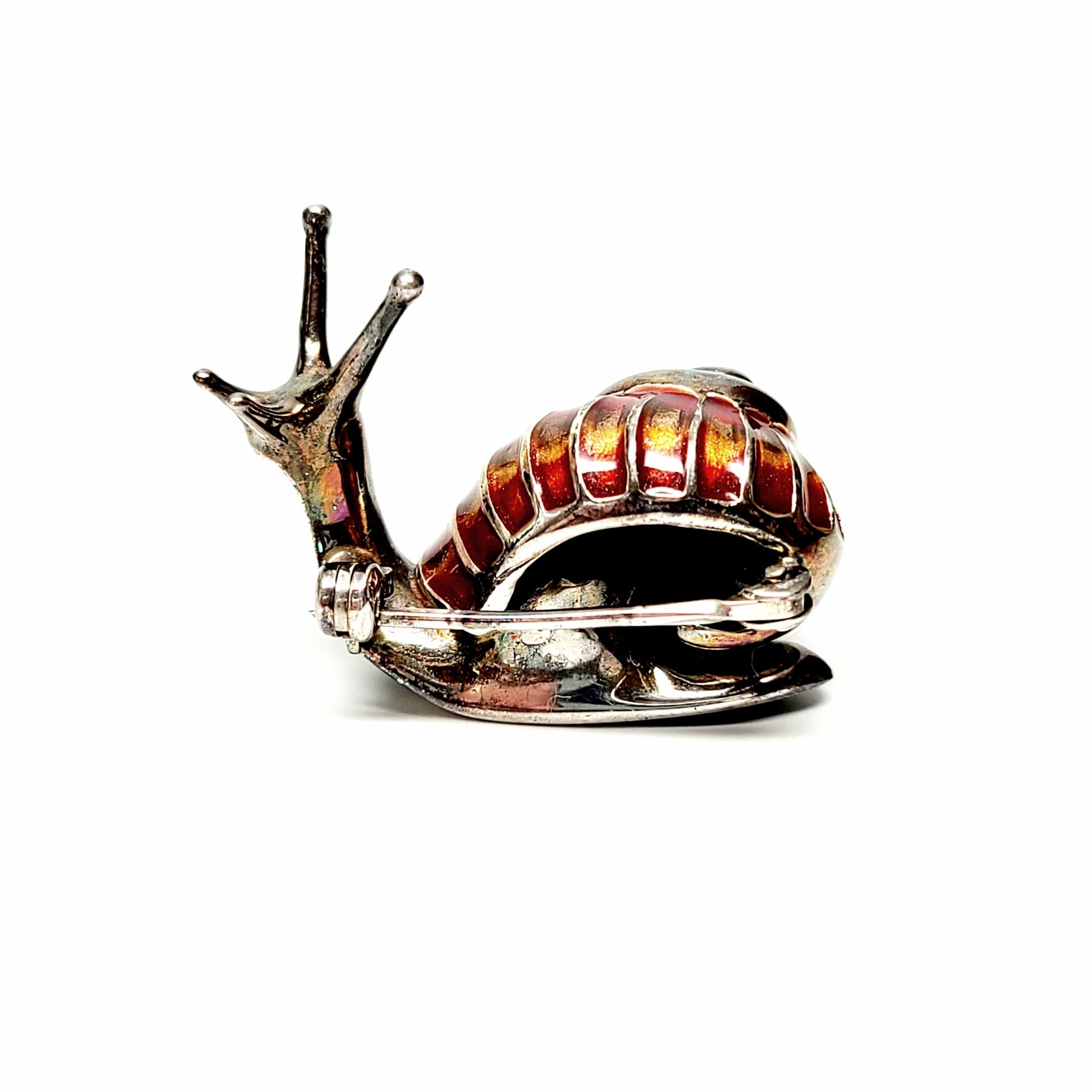 Vintage Italian sterling silver and enamel snail pin.

Beautifully hand enameled, featuring red, yellow and a hint of green enamel on a swirl shell.

Measures approx 7/8