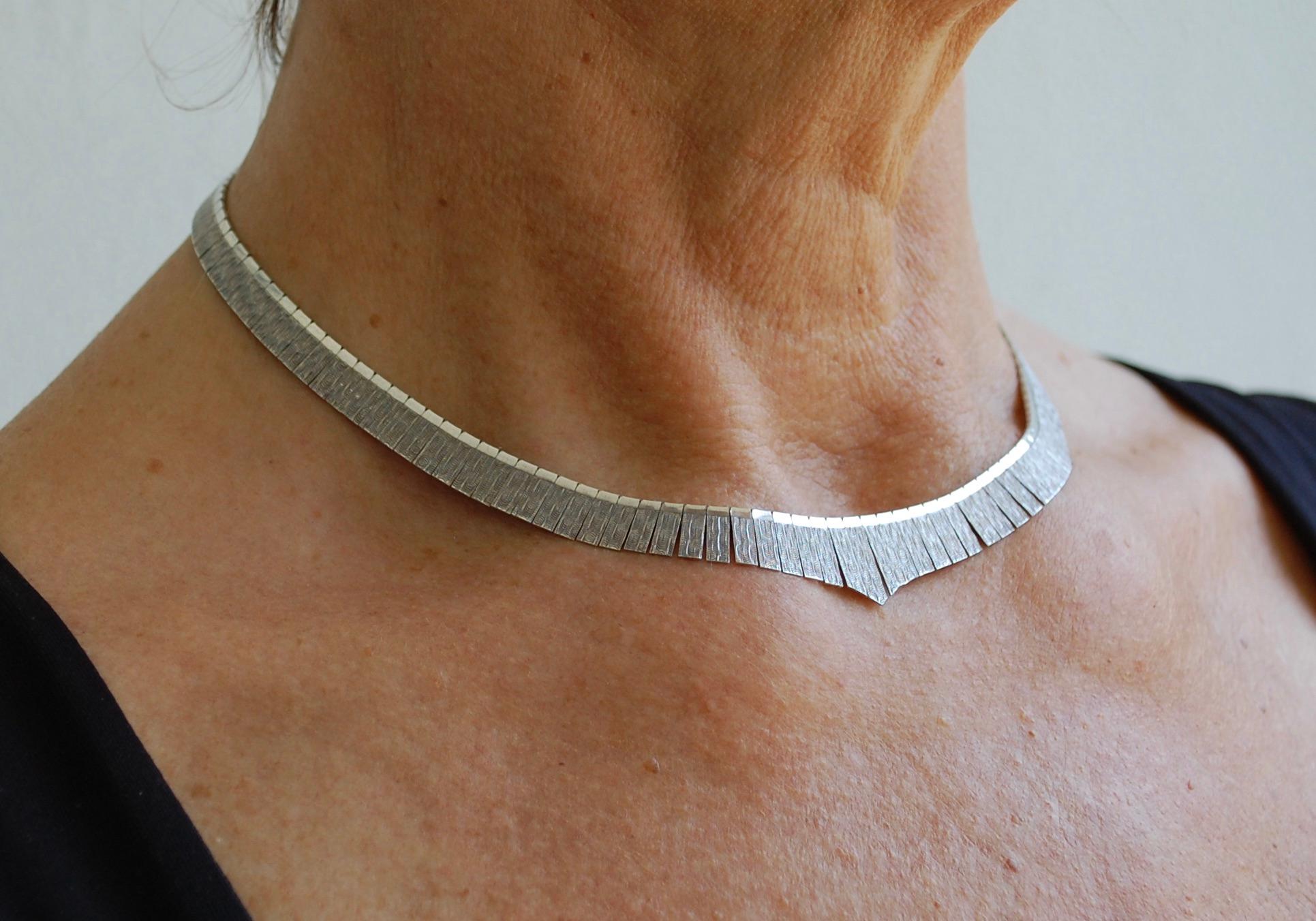 Elegant every day graduated solid brushed silver necklace marked 925 Italy. About 23 grams and 1/5 inch wide.
