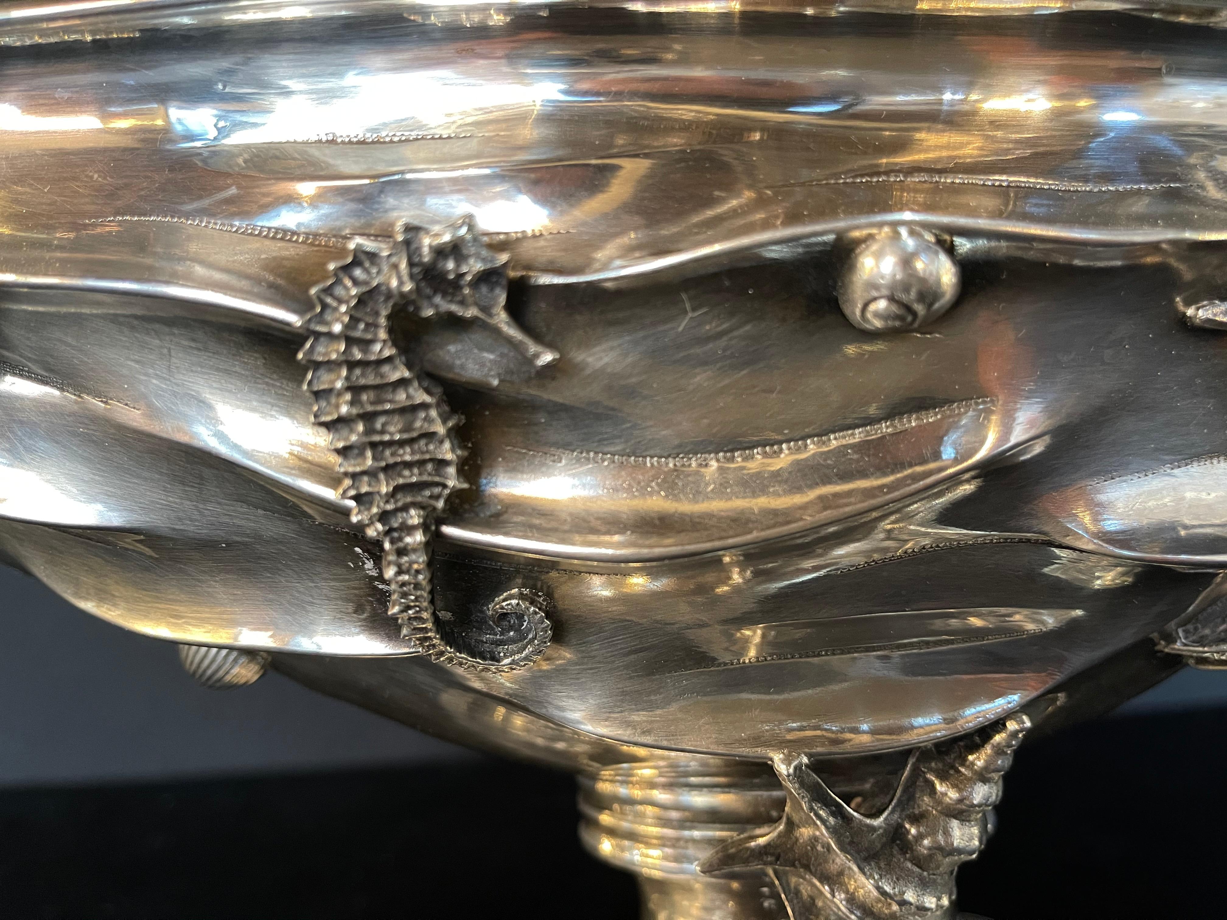 Italian sterling silver figurial centerpiece 88 troy Ozs. Buccellati style centerpiece hallmarked and stamped Italy Sterling. This one of a kind centerpiece is solid sterling having a shell base wonderfully decorated with seahorses, seashells,