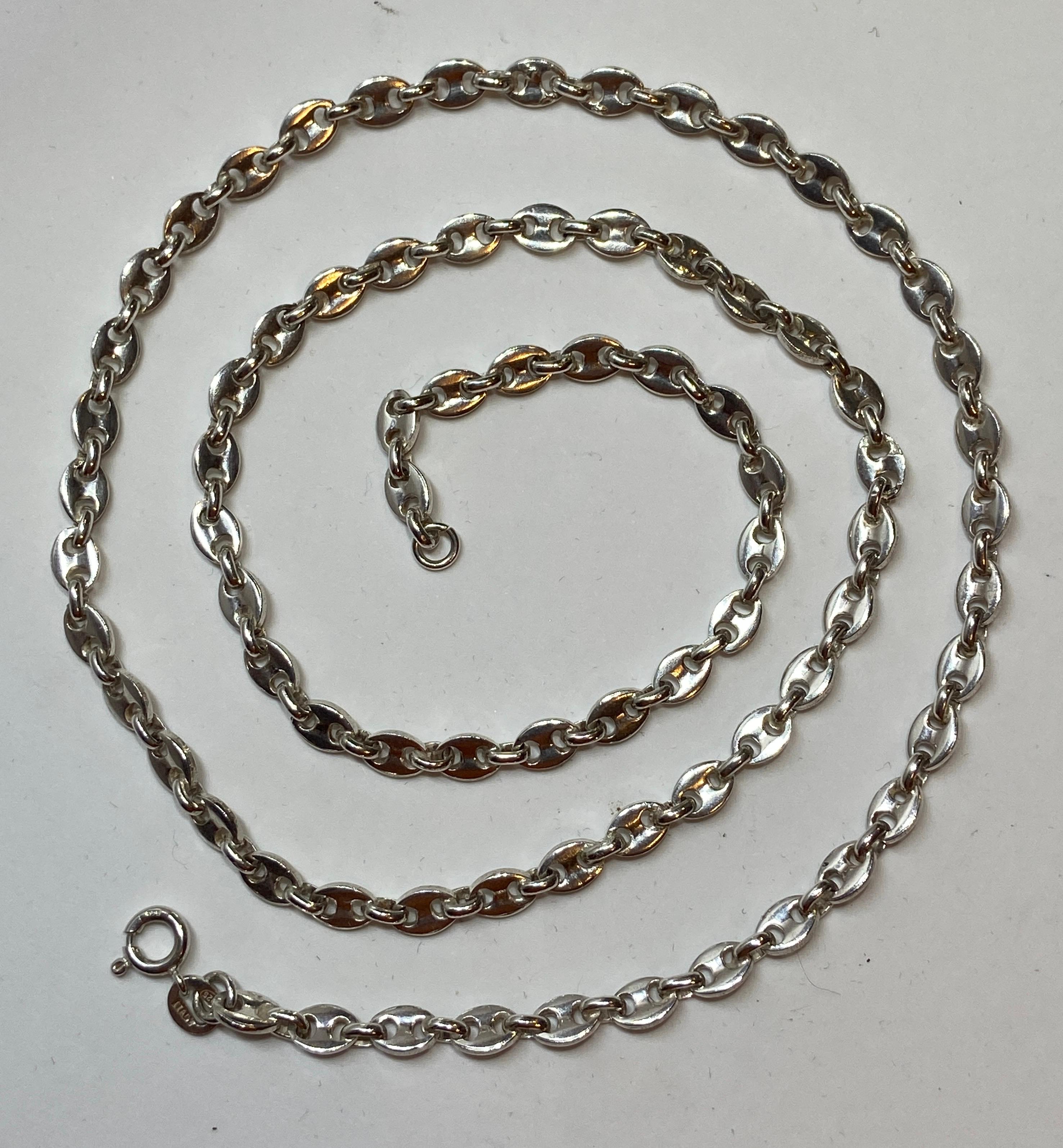      This wonderfully elegant Italian sterling silver Gucci-styled heavy chain-link necklace measures 26 inches in total length. Marked: Italy 925. Made in Italy.