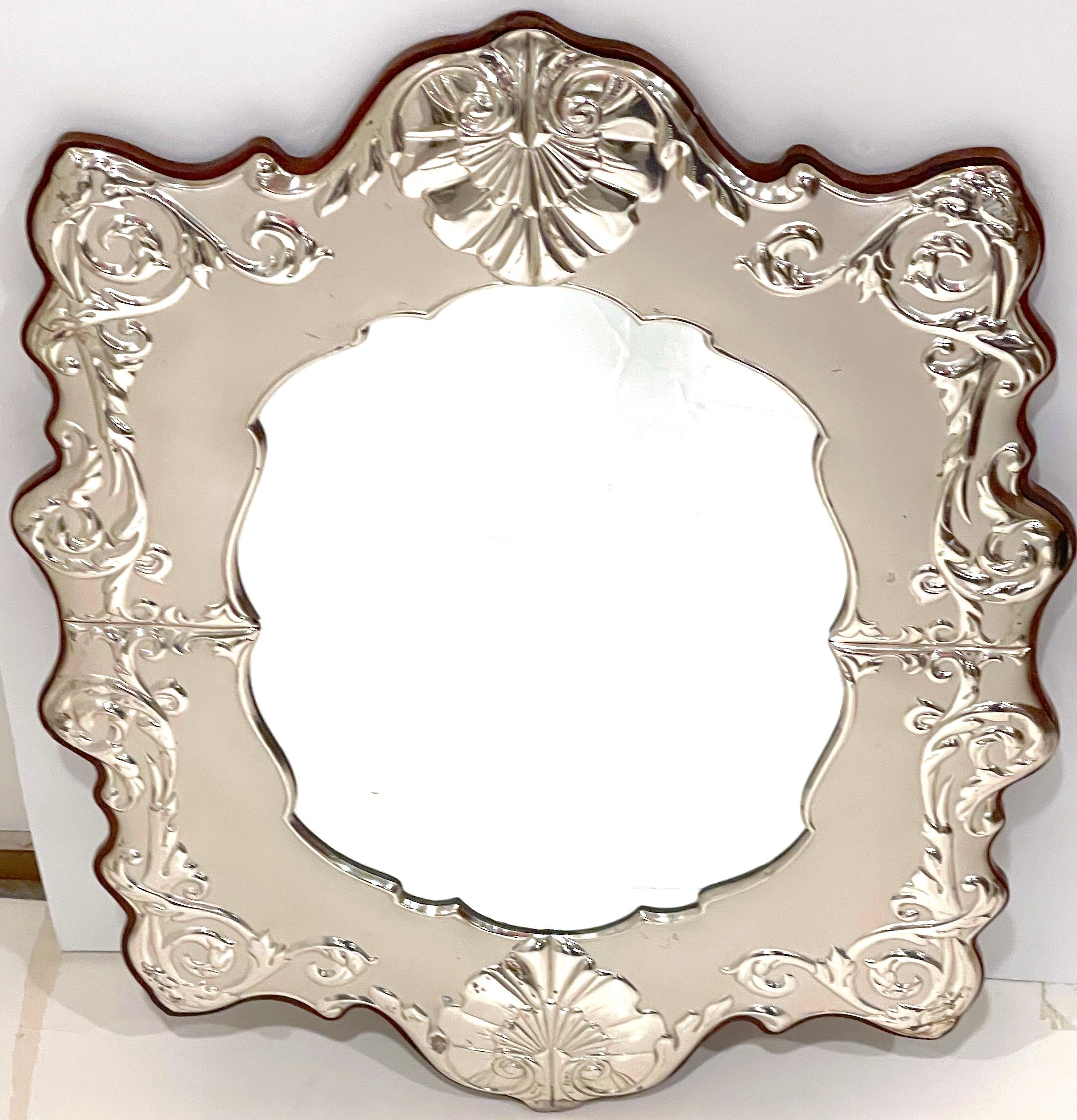 Italian Sterling Silver Neoclassical Style Wall Mirror
Italy, circa Later 20th Century 
Hallmarked numerous times .925 in oval 

A stunning Italian Sterling Silver Neoclassical Style Wall Mirror from Italy, dating from the later 20th century. This