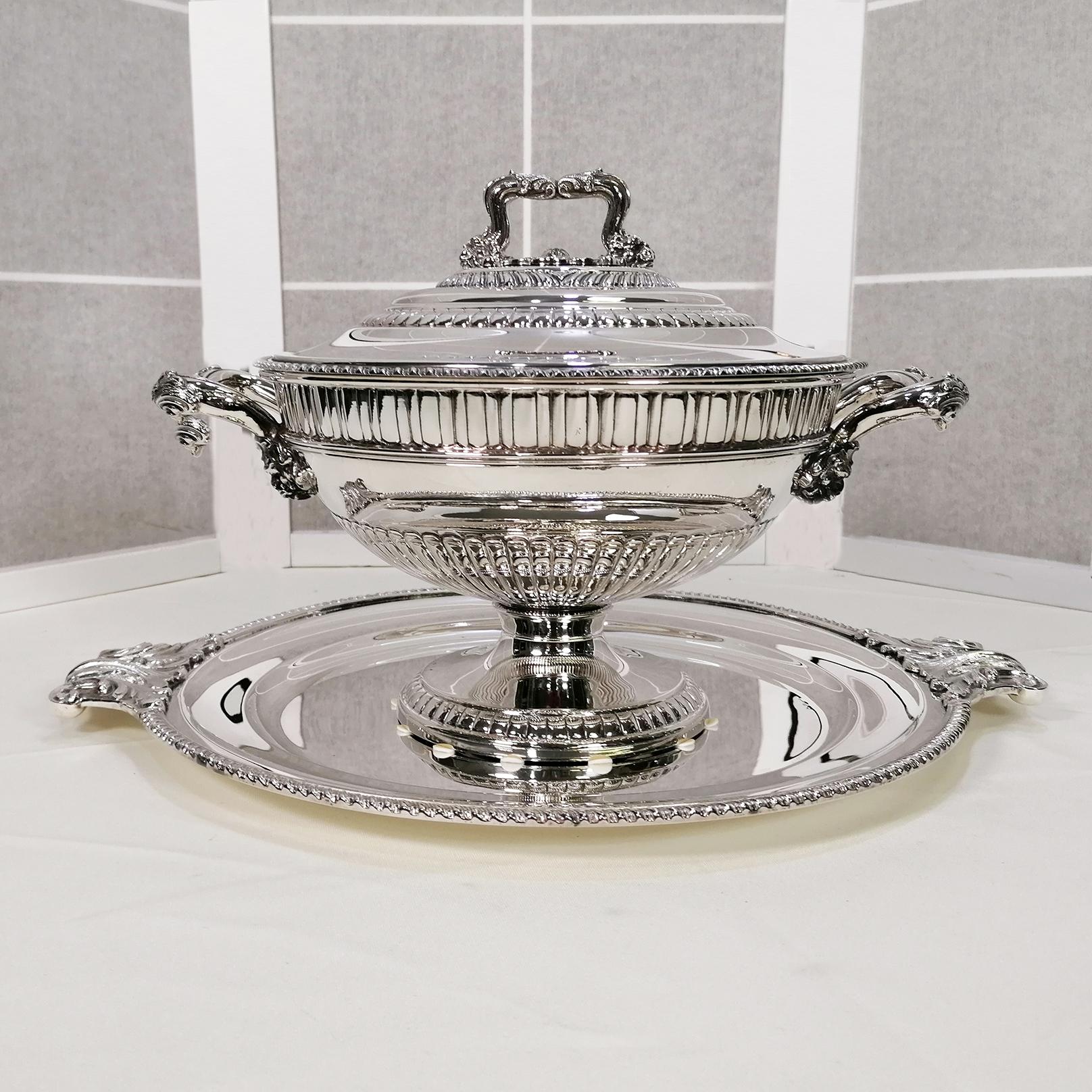 Large round sterling silver Queen Anne style tureen.
The plate is round with a welded cord border.
Two handles with an acanthus leaf design made using the fusion technique have been welded to two opposing parts. The handles were subsequently