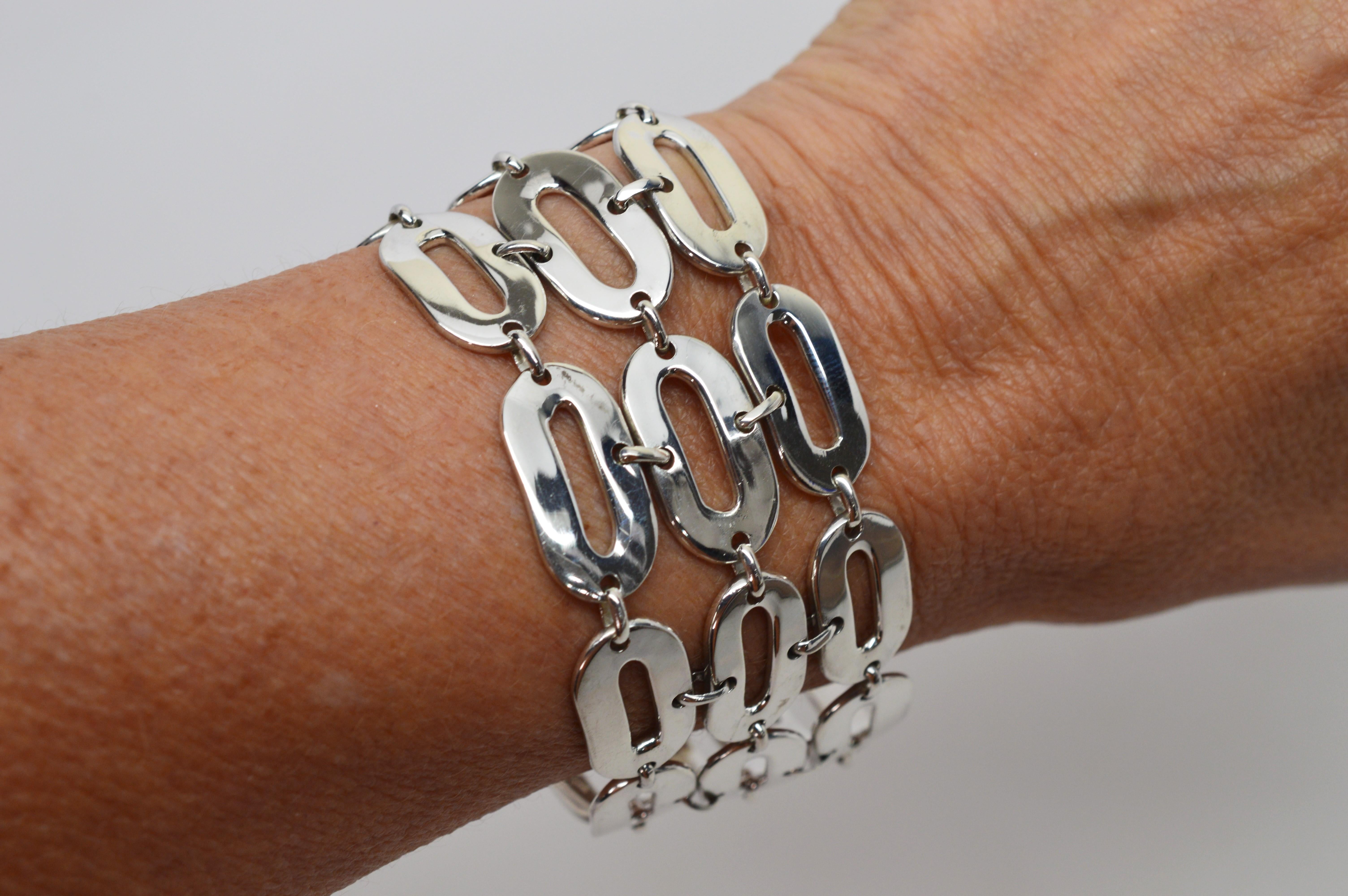 Made in Italy and signed by maker, this substantial piece presents a bold, on-trend look.  Sizable oblong links create a  1-1/2 inch wide chain bracelet of quality polished sterling silver. The bracelet length is 7-1/2 inches and finished with