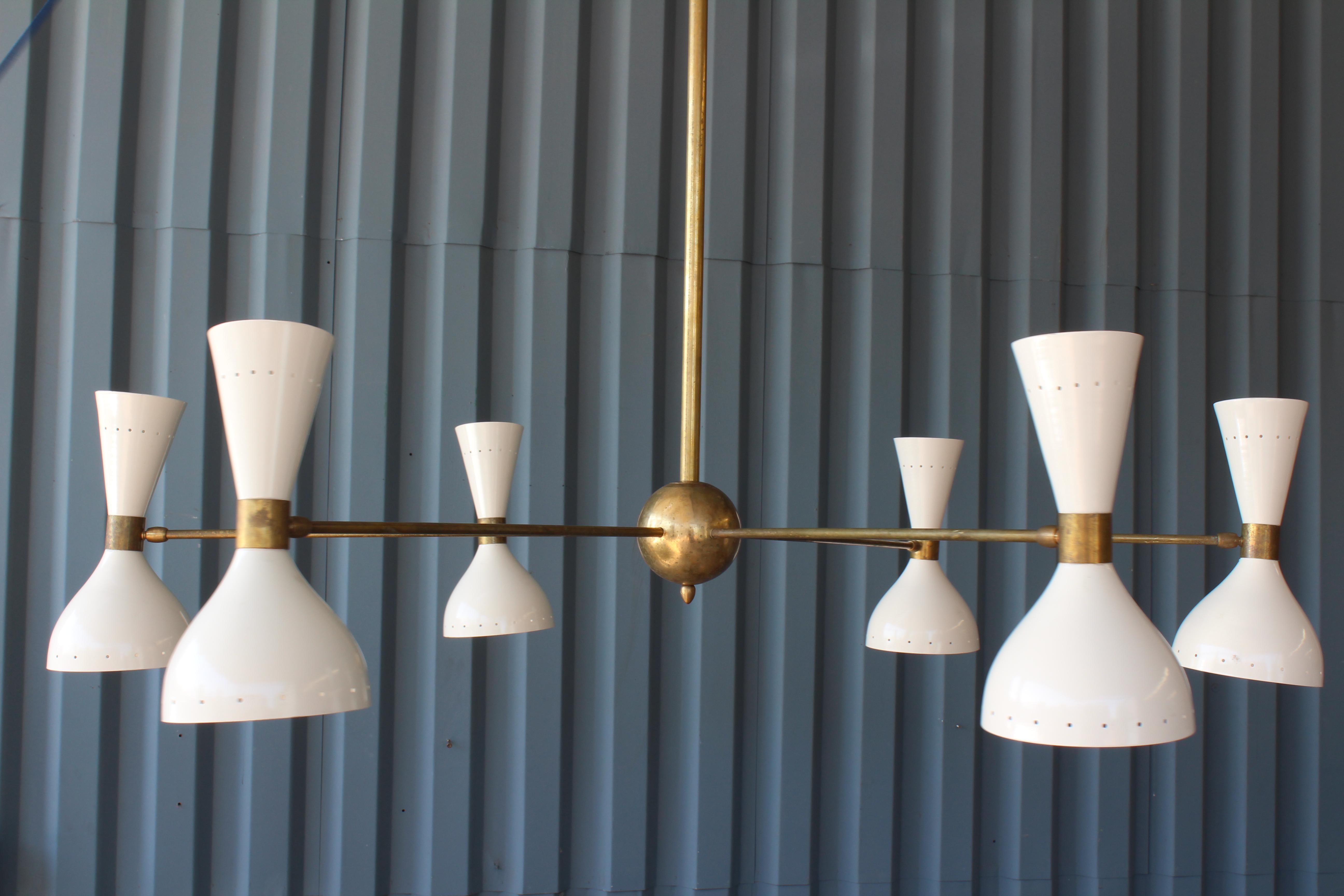 Italian brass chandelier with white metal shades.