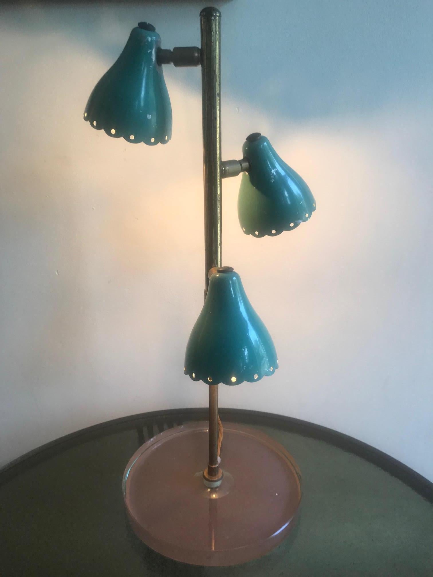 A stylish Italian three-light brass, glass and enamel table light in the manner of Stilnovo, circa 1950s Rewired for the British market.