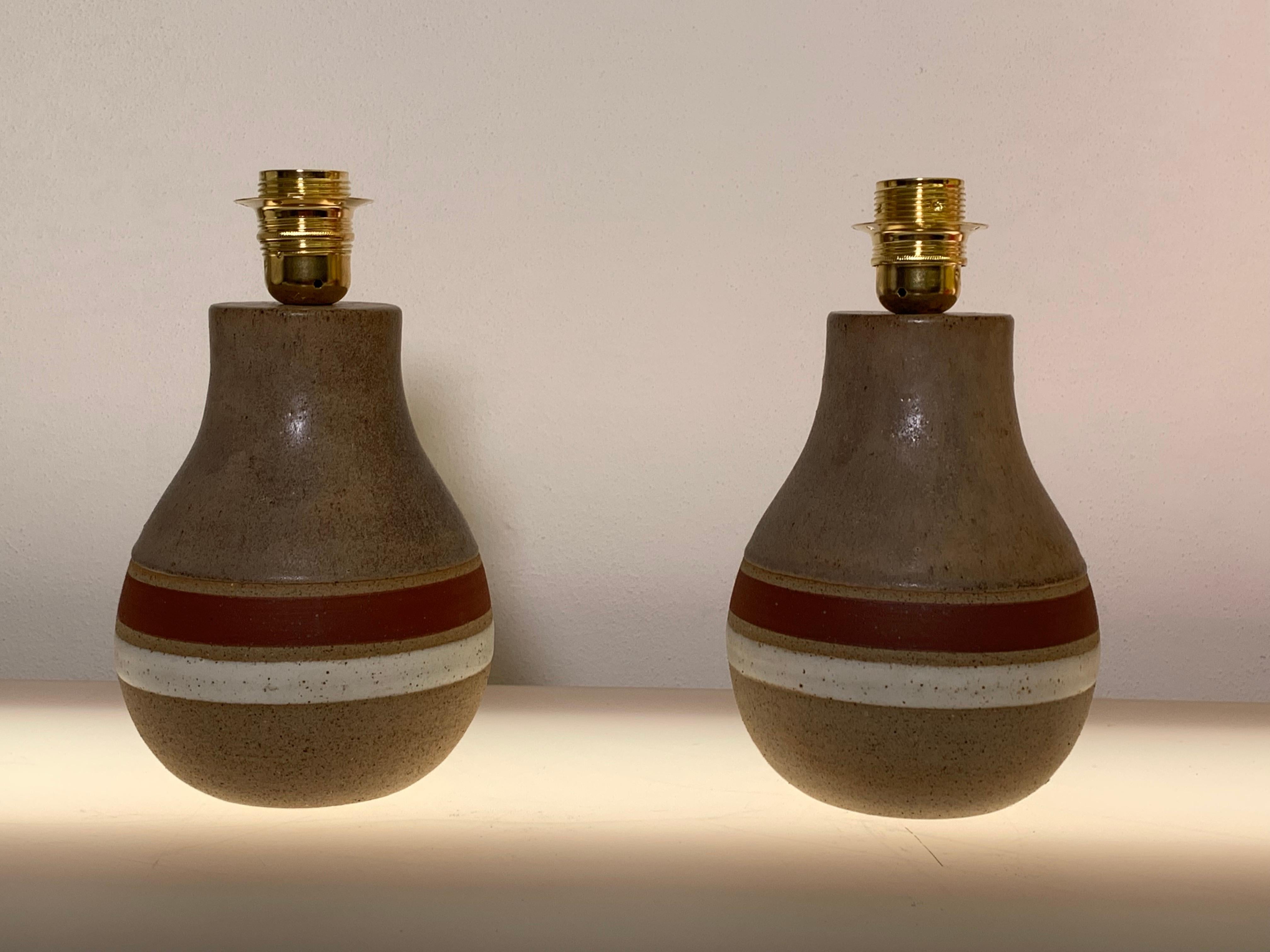 Bases of stoneware lamps designed by the famous Italian artist Bruno Gambone. Signed on the bottom.