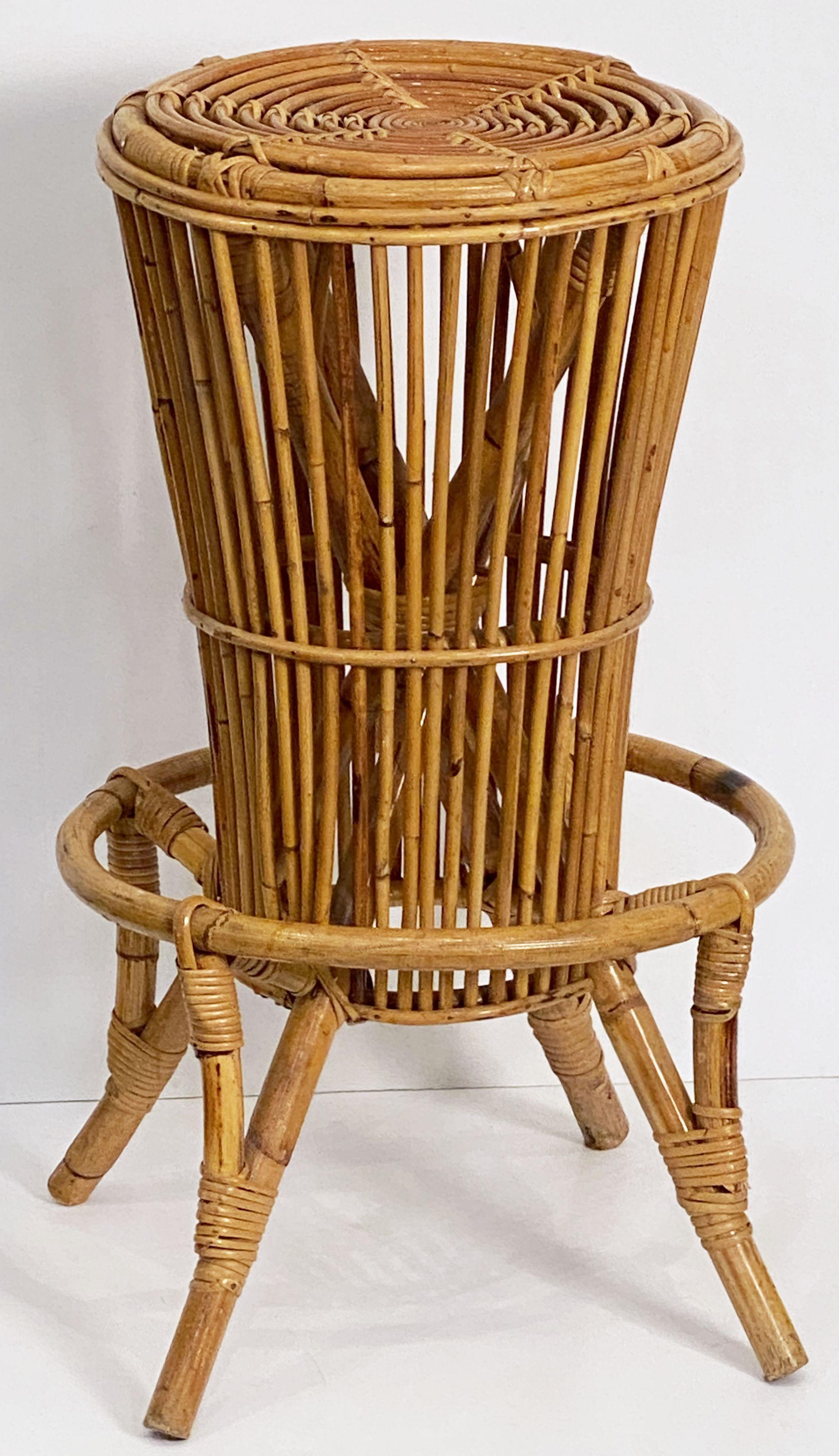 A fine vintage Italian bar stool from the mid-20th century of woven rattan and bamboo featuring a stylish design to the back, seat, and legs.

Two available.