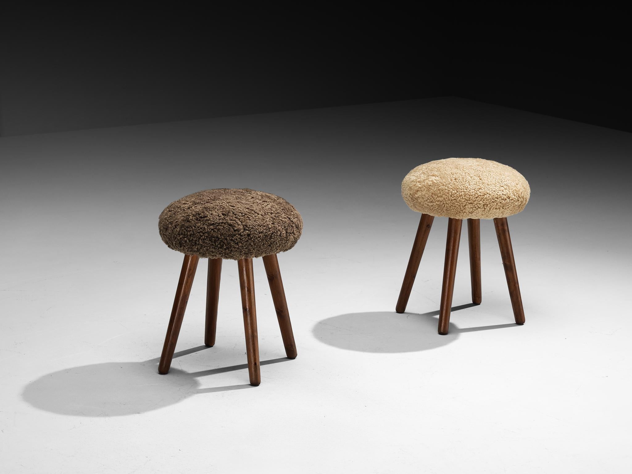 Stools, pine, sheepskin, Italy, 1960s

Charming set of stools made in Italy during the 1960s. Constructed from solid pine wood, these pieces showcase simplicity and pure design, emphasizing natural materials and clean lines. The sheepskin adds a
