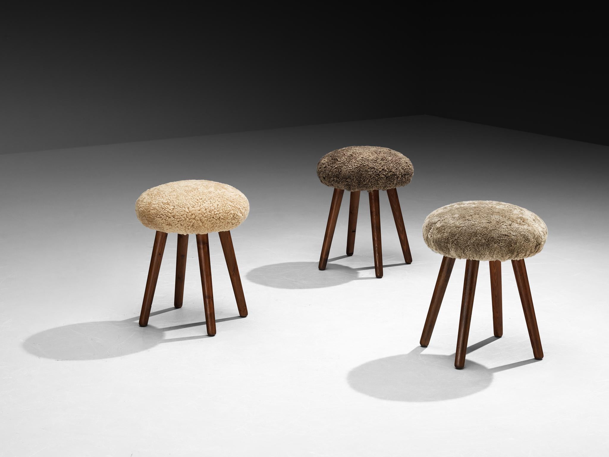 Stools, pine, sheepskin, Italy, 1960s

Charming set of stools made in Italy during the 1960s. Constructed from solid pine wood, these pieces showcase simplicity and pure design, emphasizing natural materials and clean lines. The sheepskin adds a