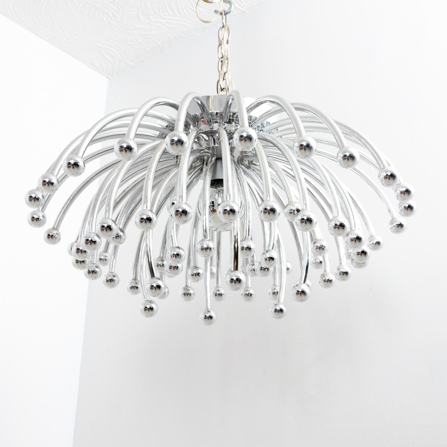 Circa 1970s Italian Studio Tetrarch Valenti Pastillo chandelier. The piece is composed of chromed ABS plastic. It can be used as a hanging chandelier, a flush mount chandelier, wall sconce, or table lamp. Rewired with new American socket and wiring.