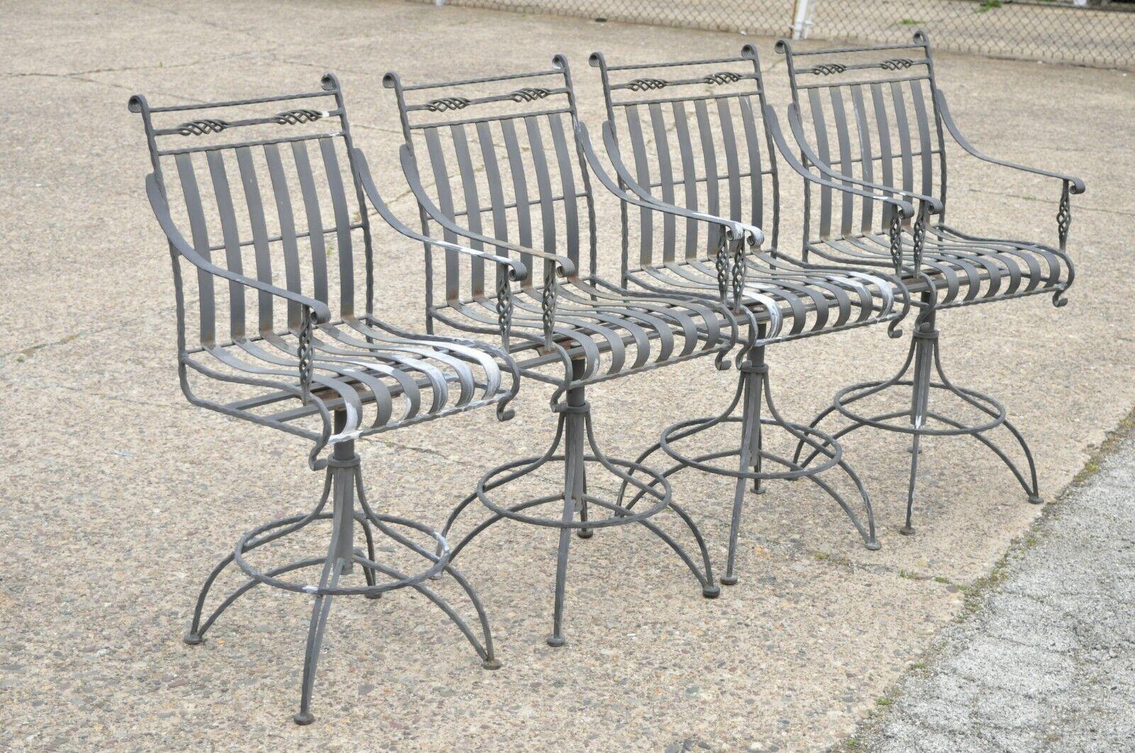 Italian style heavy scrolling wrought iron outdoor garden barstools - Set of 4. Item features (4) barstools, heavy wrought iron and steel construction, swivel seat, twisted frame, quality craftsmanship, great style and form. Circa Late 20th Century.