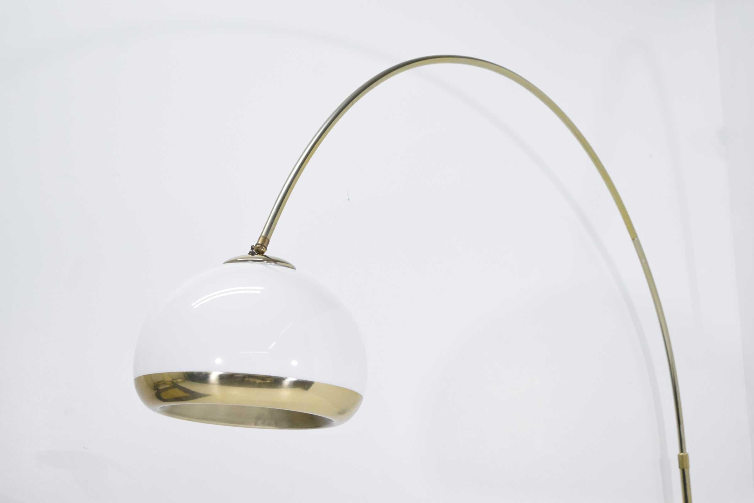 Gorgeous floor lamp with loads of drama. Heavy marble base, adjustable stem. Lucite canopy with brass trim. Measurements will vary depending on how stem is adjusted. 
 