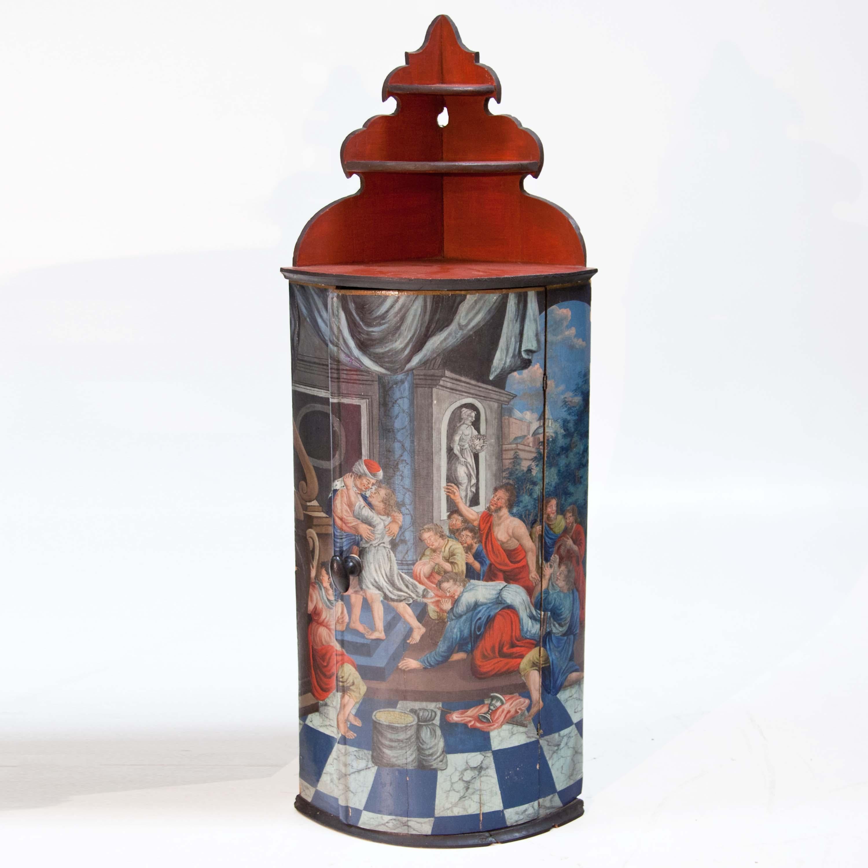 Small corner cupboard in Italian style with polychrome figural scene on the front. The segment-shaped body (side length 37 cm) is complemented by a red three-tier shelf with a cut-out back wall.