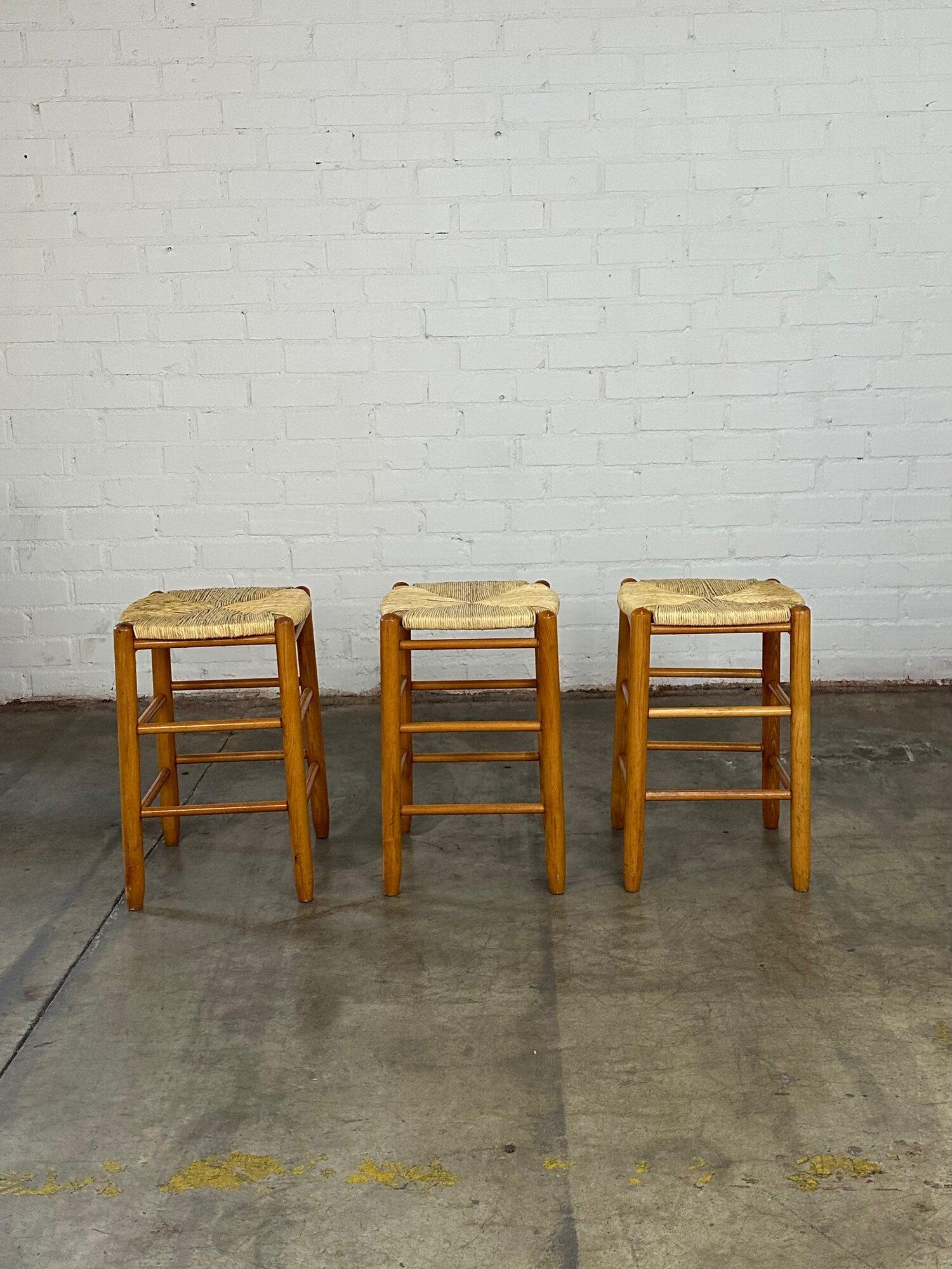 W15 D15 H23.5 SW15 SD15 SH23.5

Vintage stool in overall good condition with one minor area of wear pictured closely. The set is structurally sound and overall shows well. Price is for the set of three.