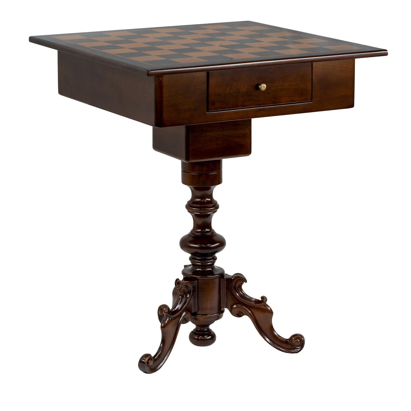 This elegant chess table embodies Italian craftsmanship and classic style. Made of solid lime wood with a rich walnut finish, it features a hand-carved leg that adds sophistication to any setting. A small integrated drawer keeps chess pieces neatly