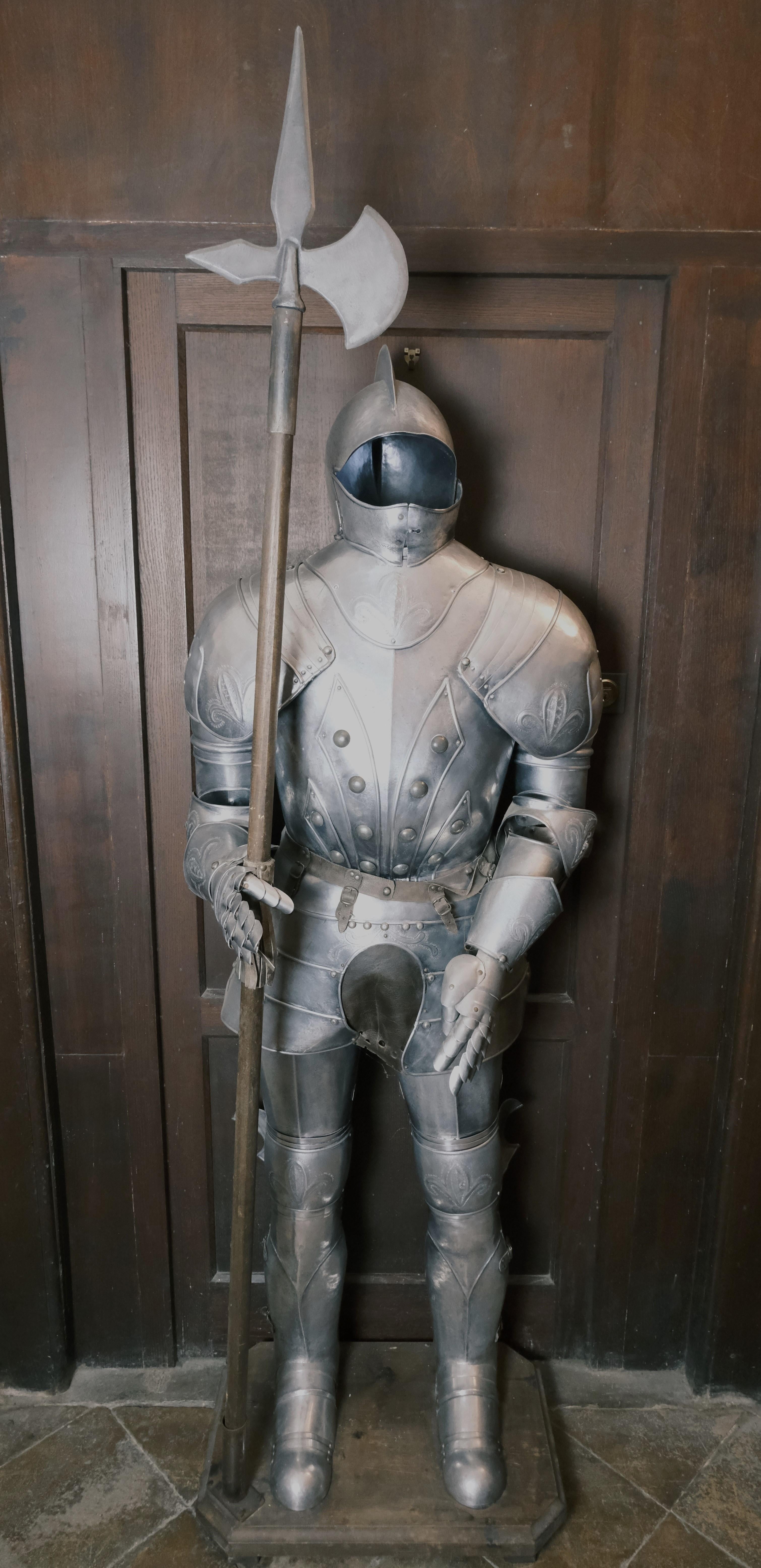 Hutton-Clarke Antiques is delighted to present a replicated Italian suit of armor crafted in the 20th century. Fashioned in the Renaissance style, this piece exhibits meticulous attention to detail, featuring ornate chased work. It stands proudly on