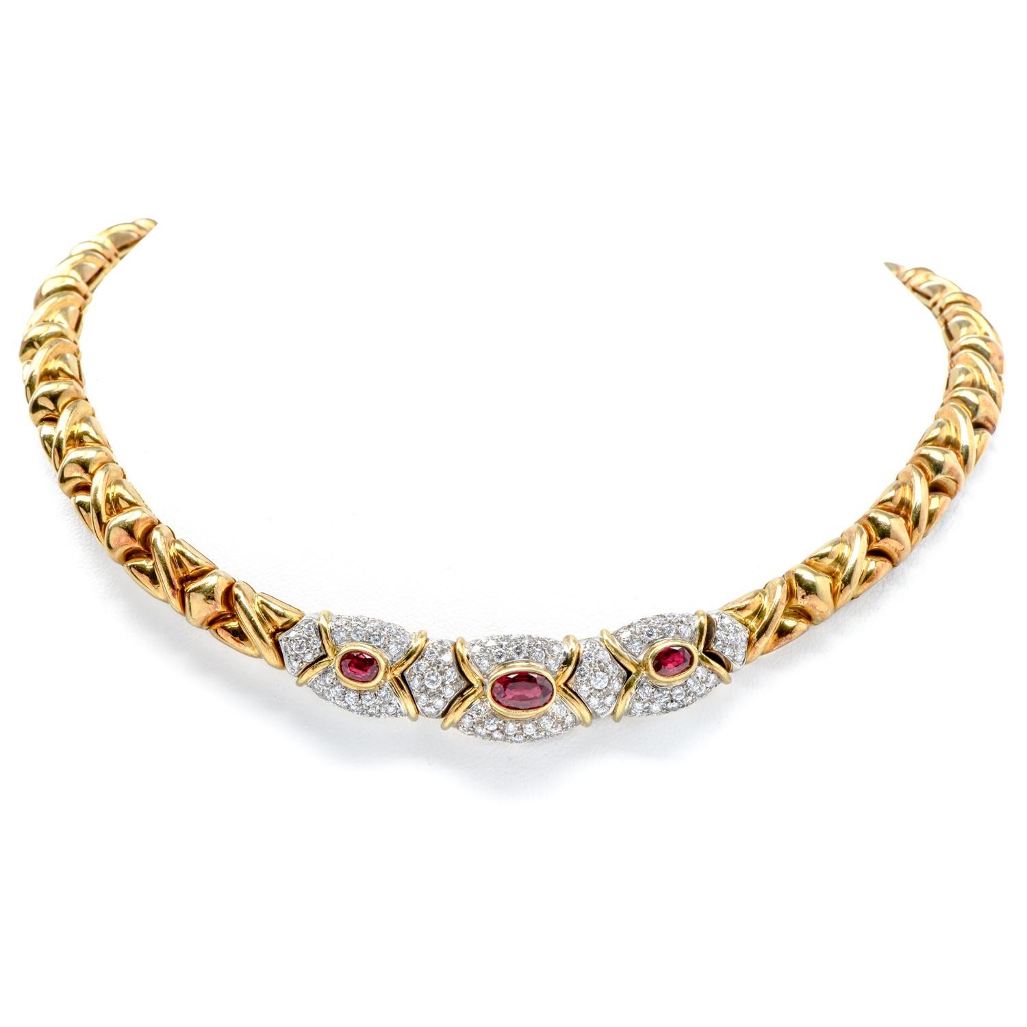 An exquisite Italian-made set of Diamond & Ruby jewelry, with matching ring, earrings & spectacular collar link necklace.

Completely crafted in 18K Yellow Gold with 18K White Gold accents.

The necklace is 15
