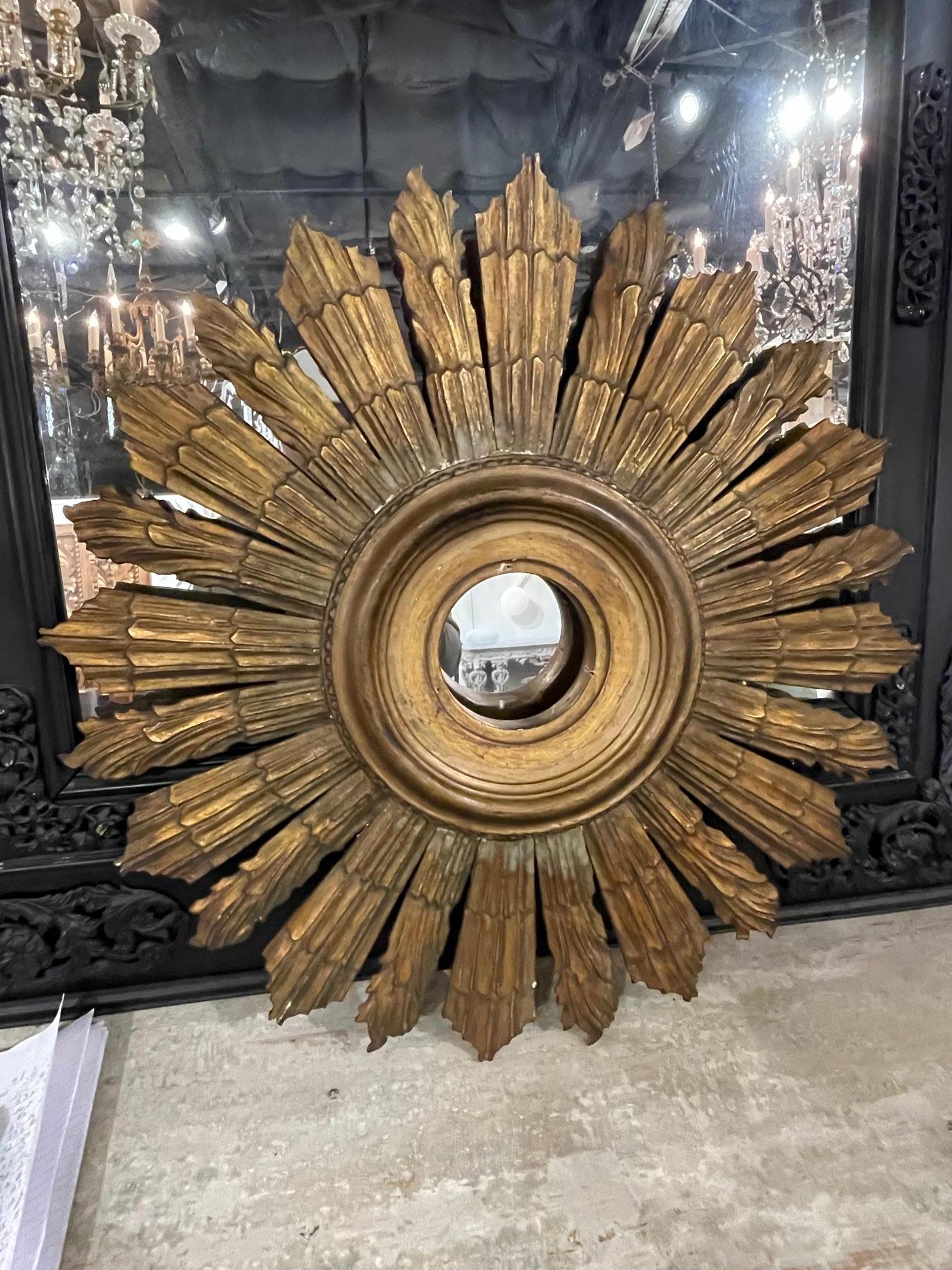 Vintage Italian carved and giltwood sunburst frame, Circa 1920. This is a nicely carved piece that will accent in room beautifully.