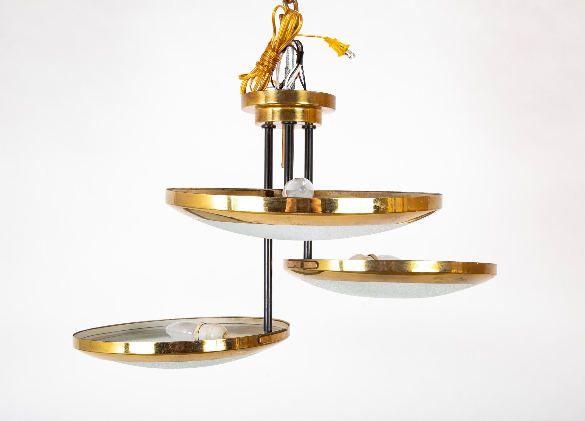 Suspended ceiling light with three brass framed discs by Stilnovo. 

