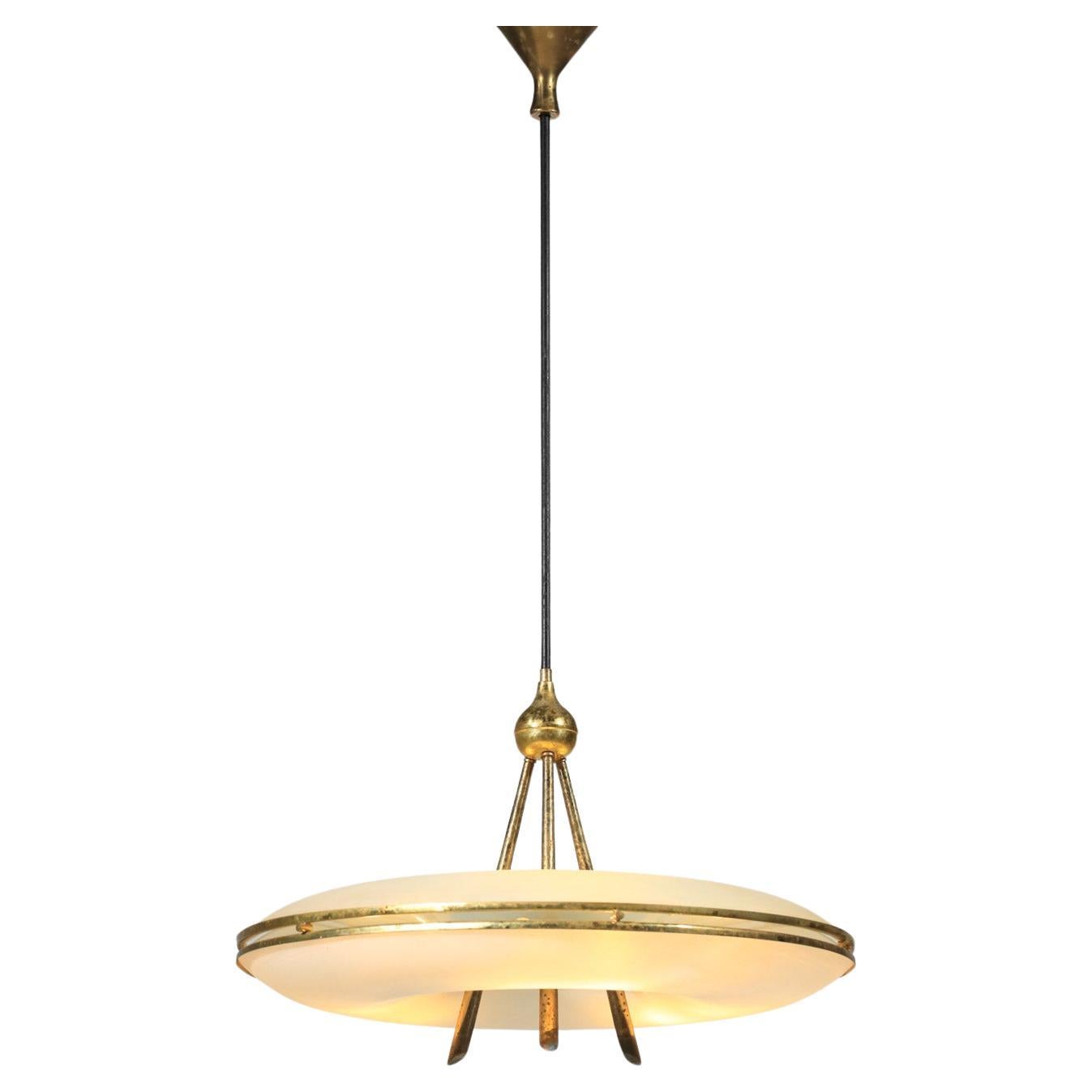 Italian pendant light from the 50s in the style of the work of Pietro Chiesa or Fontana Arte of the time. Very original chandelier in the shape of a saucer or donut with two cups in white opaline. The structure and the attachment system are entirely