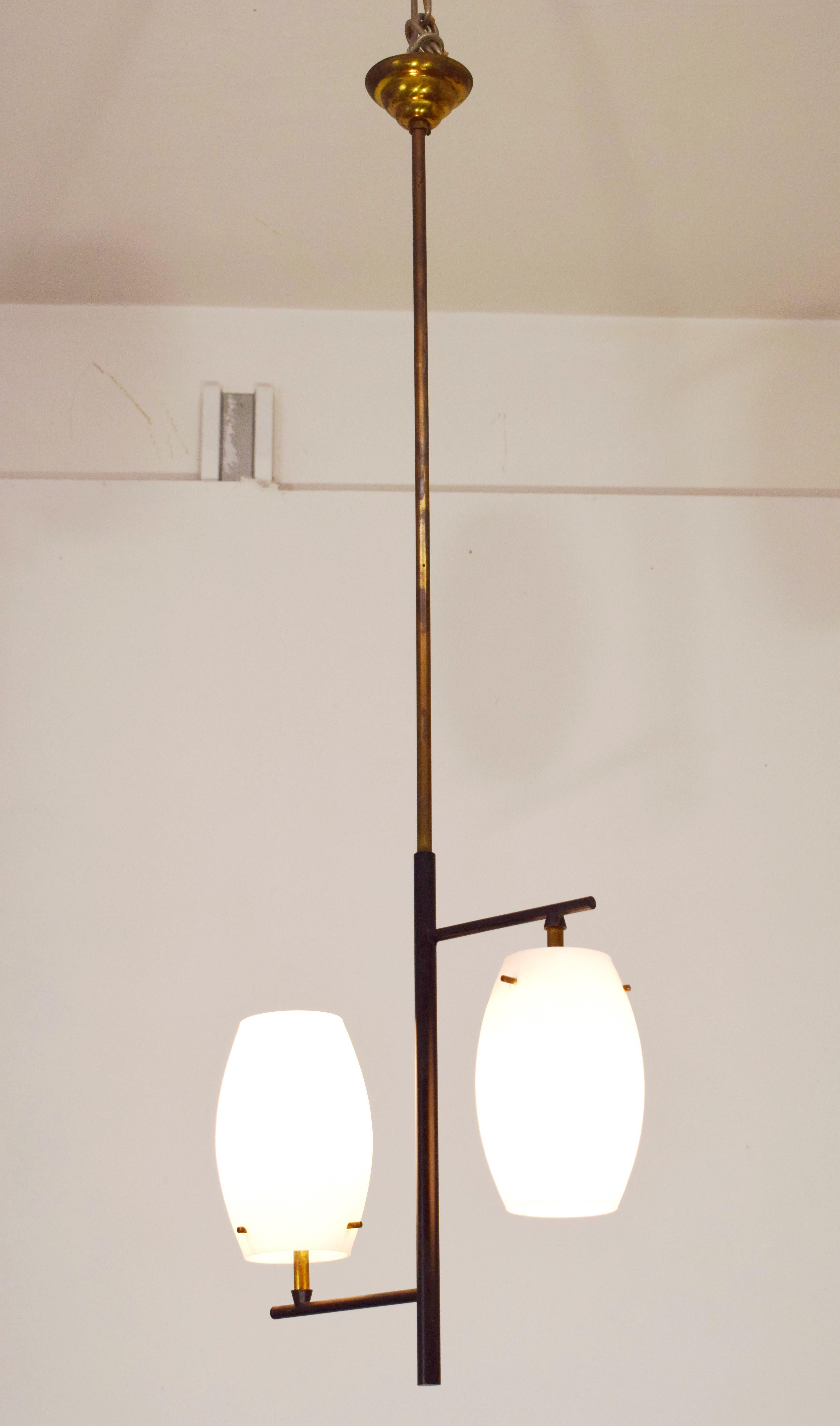 Italian suspension lamp by Stilnovo, 1950s.
Quantity 2.
Dimensions: H= 92 cm; W= 30 cm; D= 10 cm.