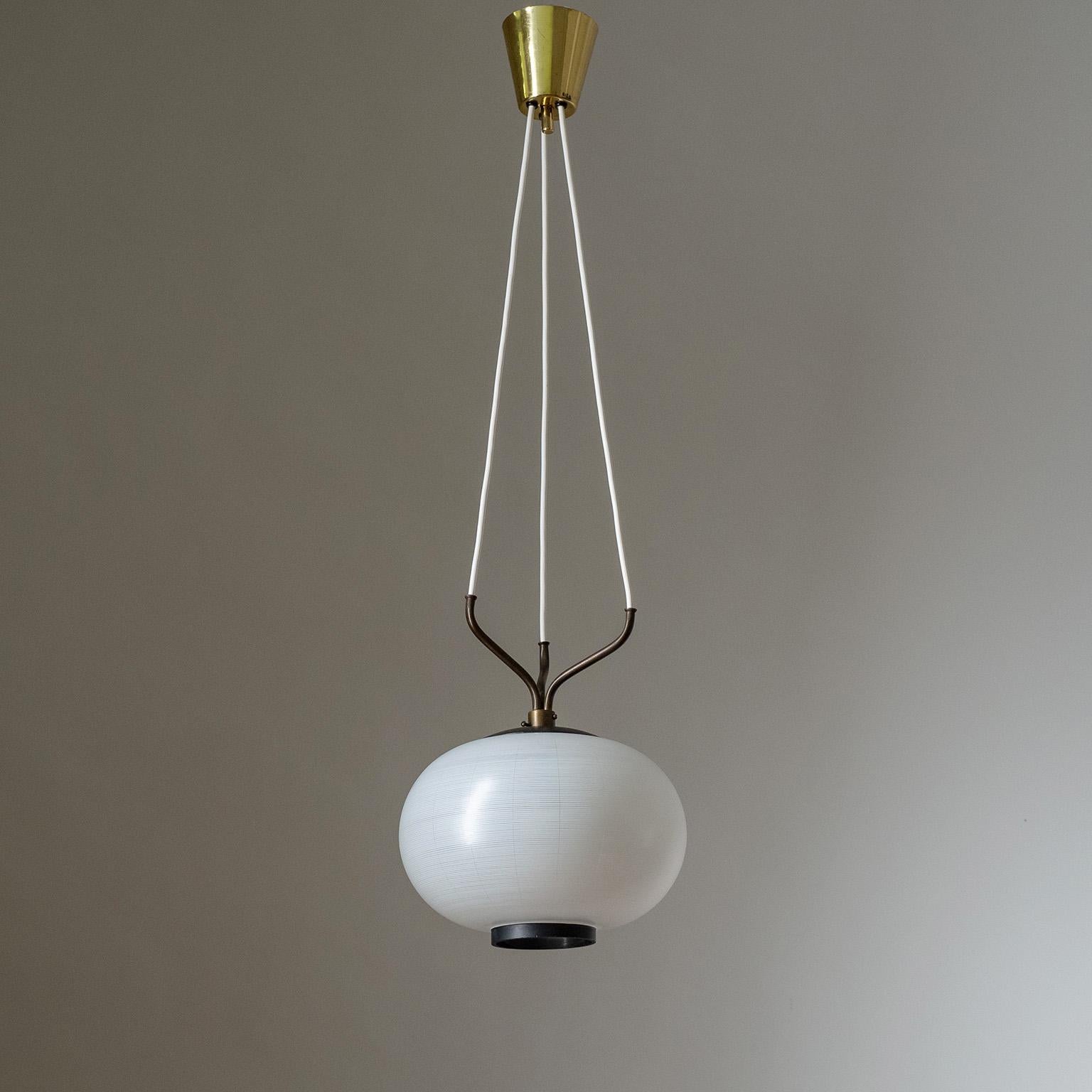 Fine Italian suspension light from the 1950s. The glass diffuser, which is enameled with a white pinstripe decor and black rim, is suspended by wires which lead into a three-pronged brass fixture. One original brass and ceramic E27 socket with new