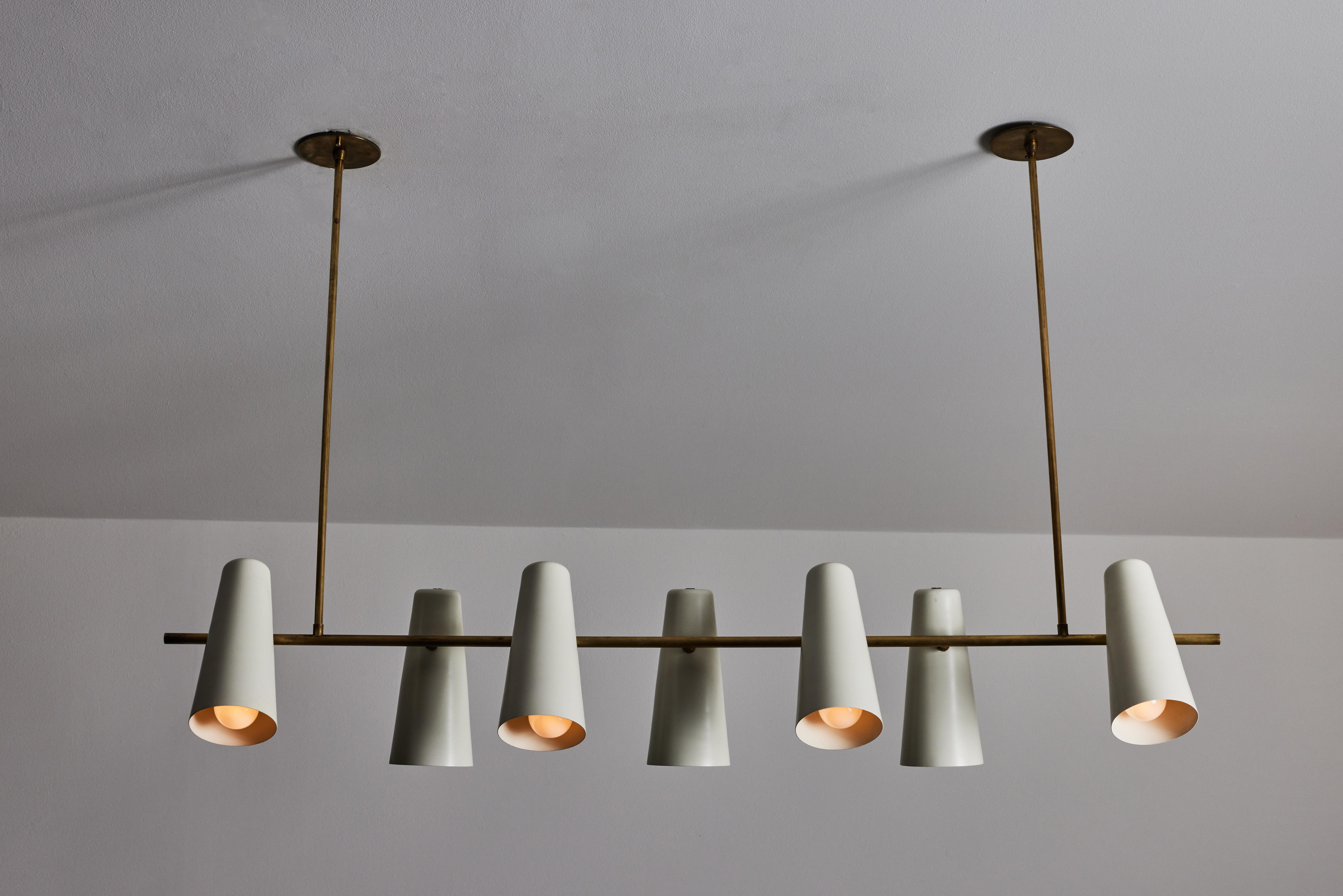 Seven shade Italian suspension light. Manufactured in Italy, circa 1950s. Enameled aluminum, brass, custom brass ceiling plates. Rewired for U.S. standards. Shades adjust up/down. We recommend seven E26 25w maximum bulbs. Bulbs provided as a one