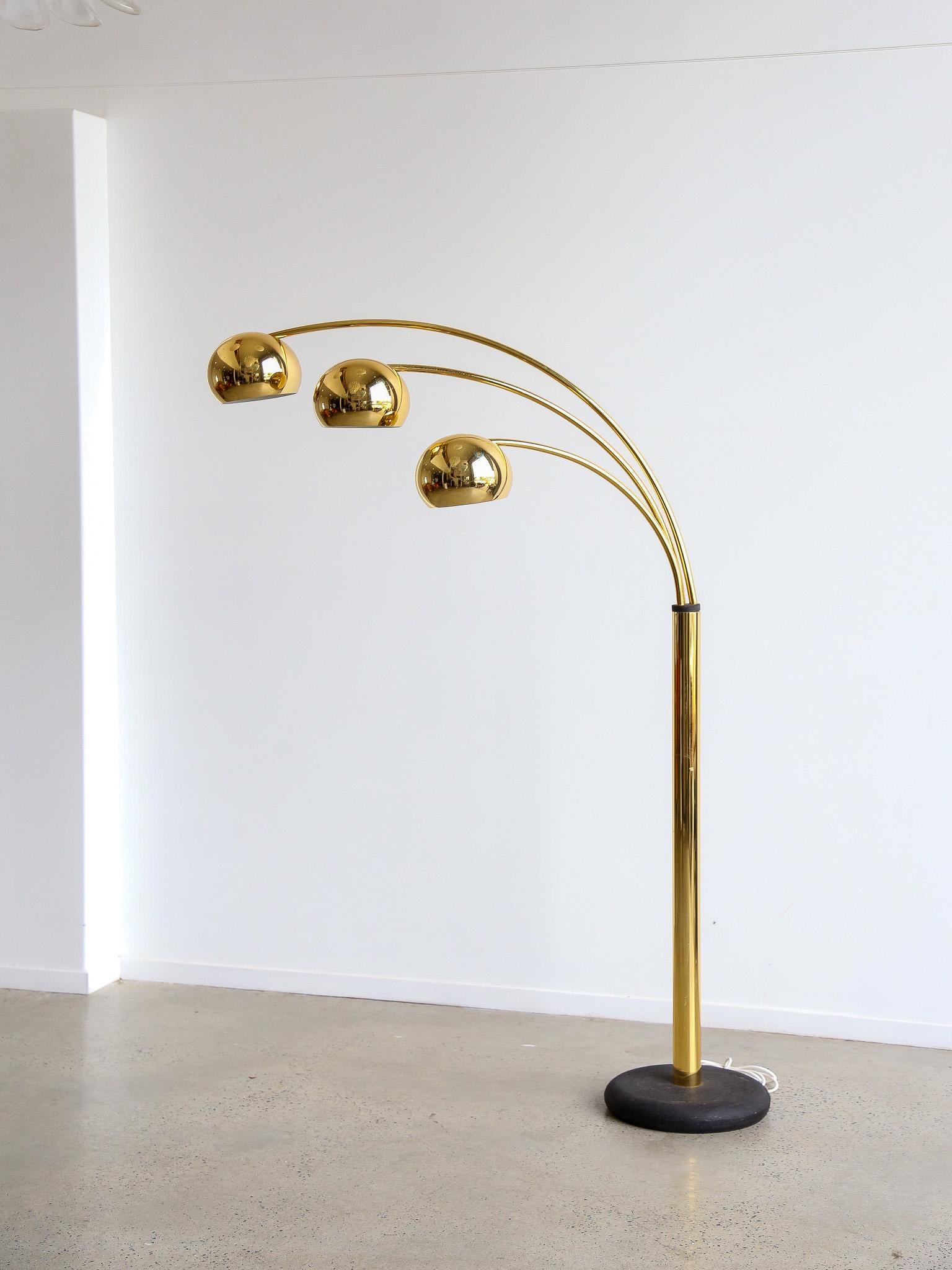 Rare and iconic floor lamp with three adjustable spheres in gilded metal and painted cast iron base by Goffredo Reggiani, Italy, 1970s.

Goffredo Reggiani was an Italian industrial designer and the founder of the lighting company Reggiani