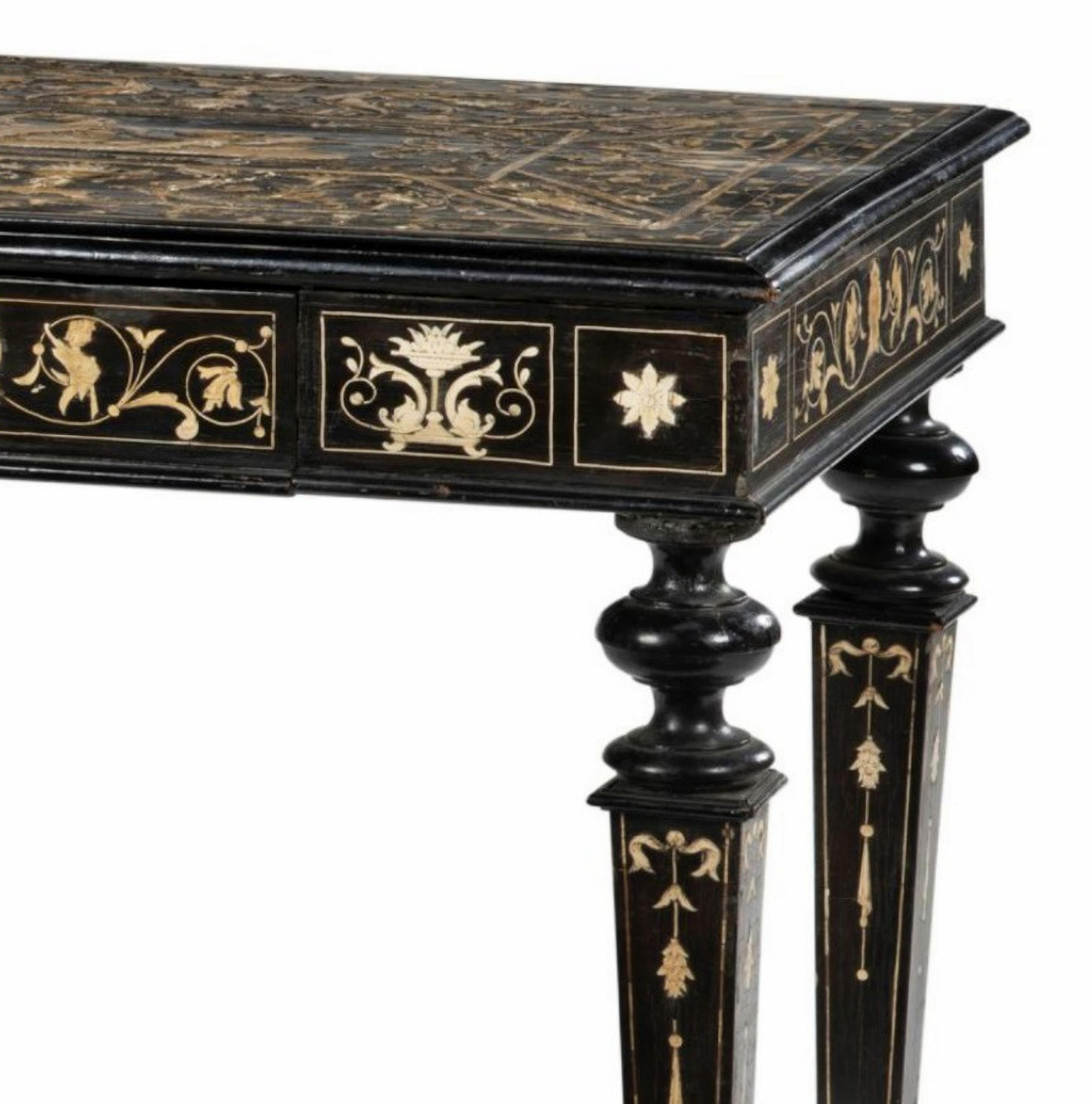 Italian Table in Ebonized Wood and Engraved Inlays 19th Century
Milan-Italy
rectangular in shape, opening to a drawer, with arabesque decoration of stylized foliage, chimera and vases; some restorations and losses.
Nineteenth century.
H: 73 cm, L:
