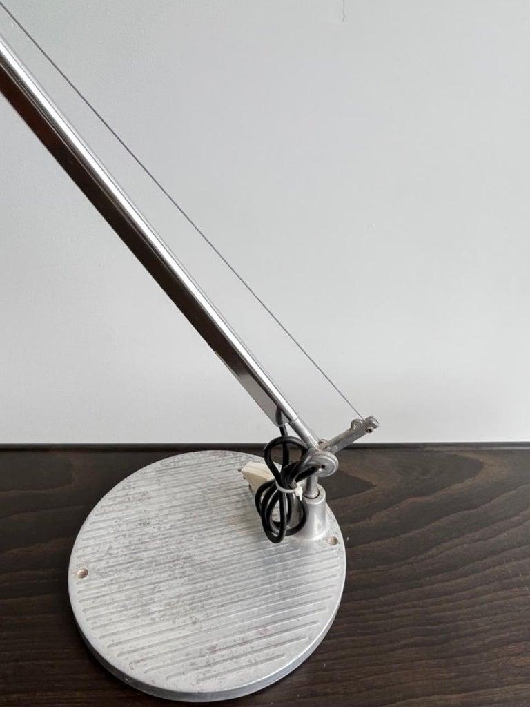  Michele De Lucchi and Giancarlo Fassina designed these retractable and adjustable Table or Desk light for Artemide, Italy. Designed by Michele De Lucchi and Giancarlo Fassina, the Tolomeo Mini Table Lamp features the same award-winning engineering