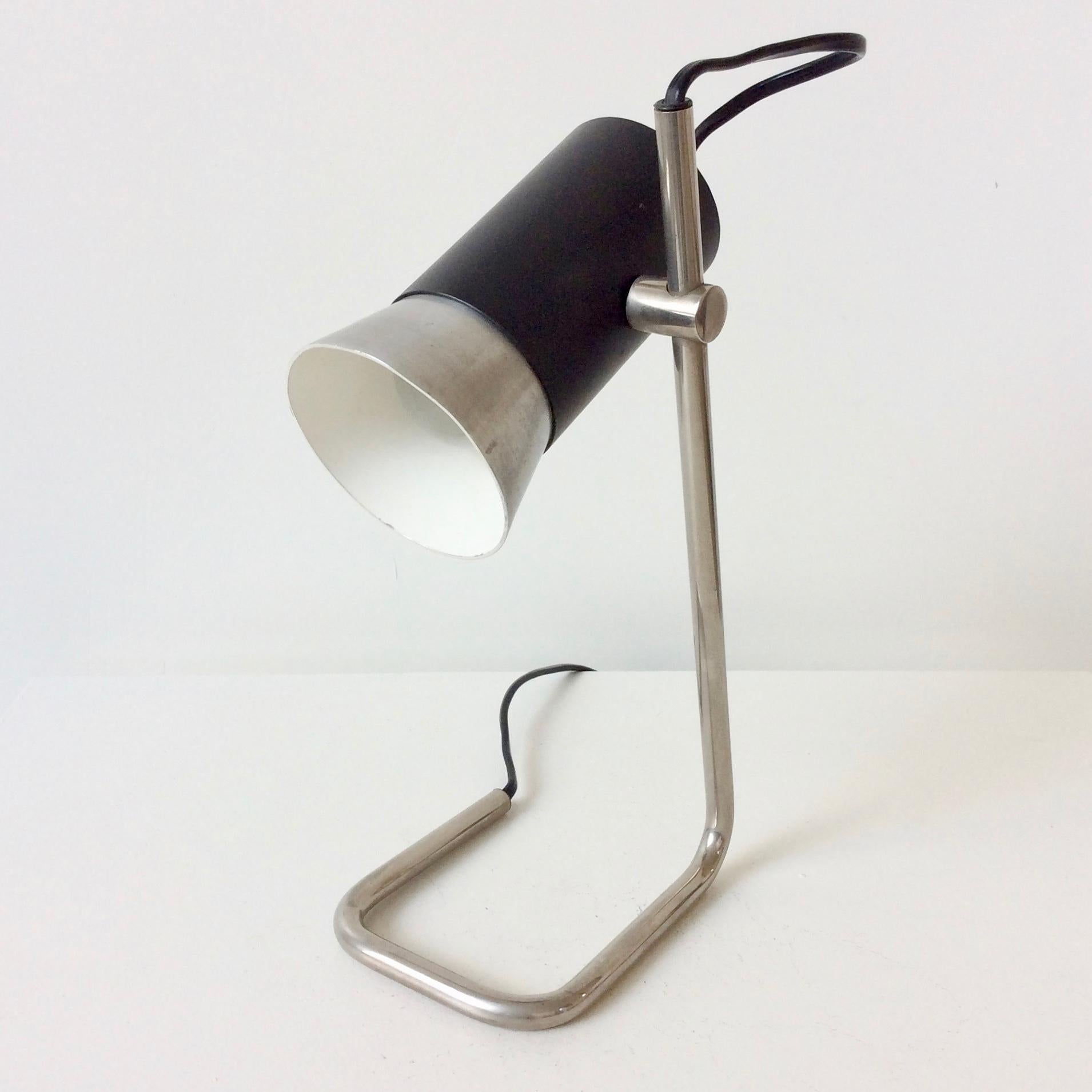 Nice desk or table lamp, attributed to Stilnovo, circa 1960, Italy.
Aluminum, black metal and chromed tubular steel.
Dimensions: 29 cm H, 19 cm W, 10 cm D.
Good original condition.
We ship worldwide.
All purchases are covered by our Buyer Protection