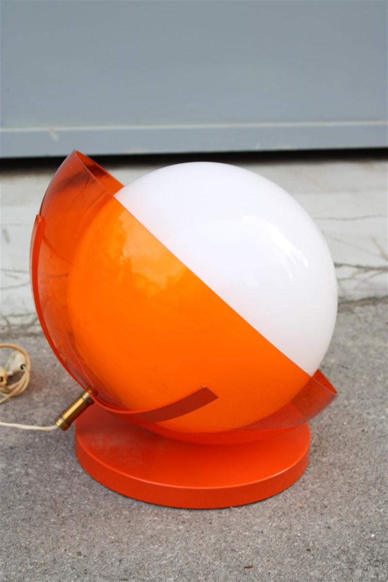 Italian table lamp curved plexiglass Harvey Guzzini design 1960s orange white.