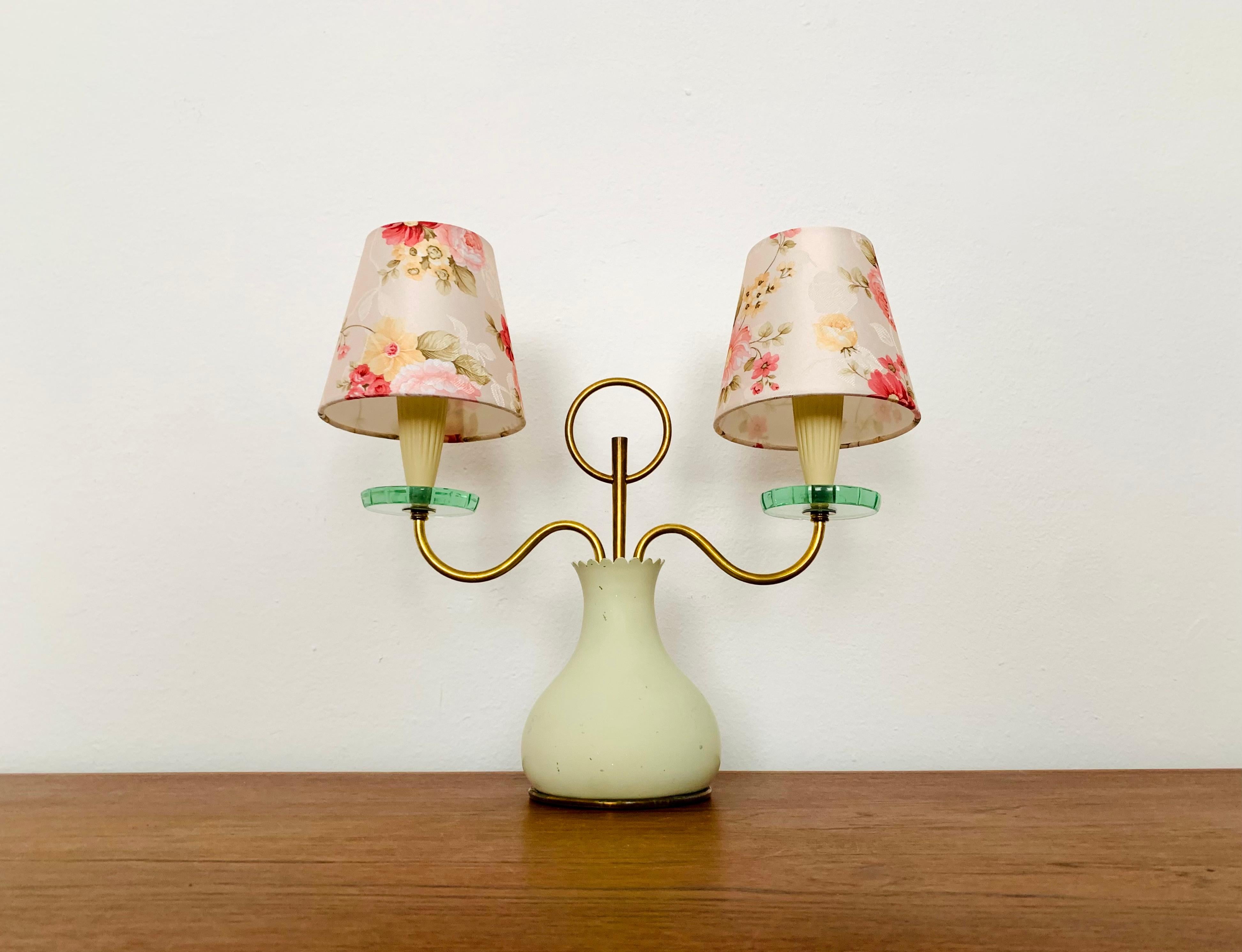 Exceptionally decorative Italian table lamp from the 1950s.
Loving details and an enrichment for every home.
A cozy light is created.

Condition:

Good vintage condition with slight signs of wear consistent with age.
The metal parts are beautifully