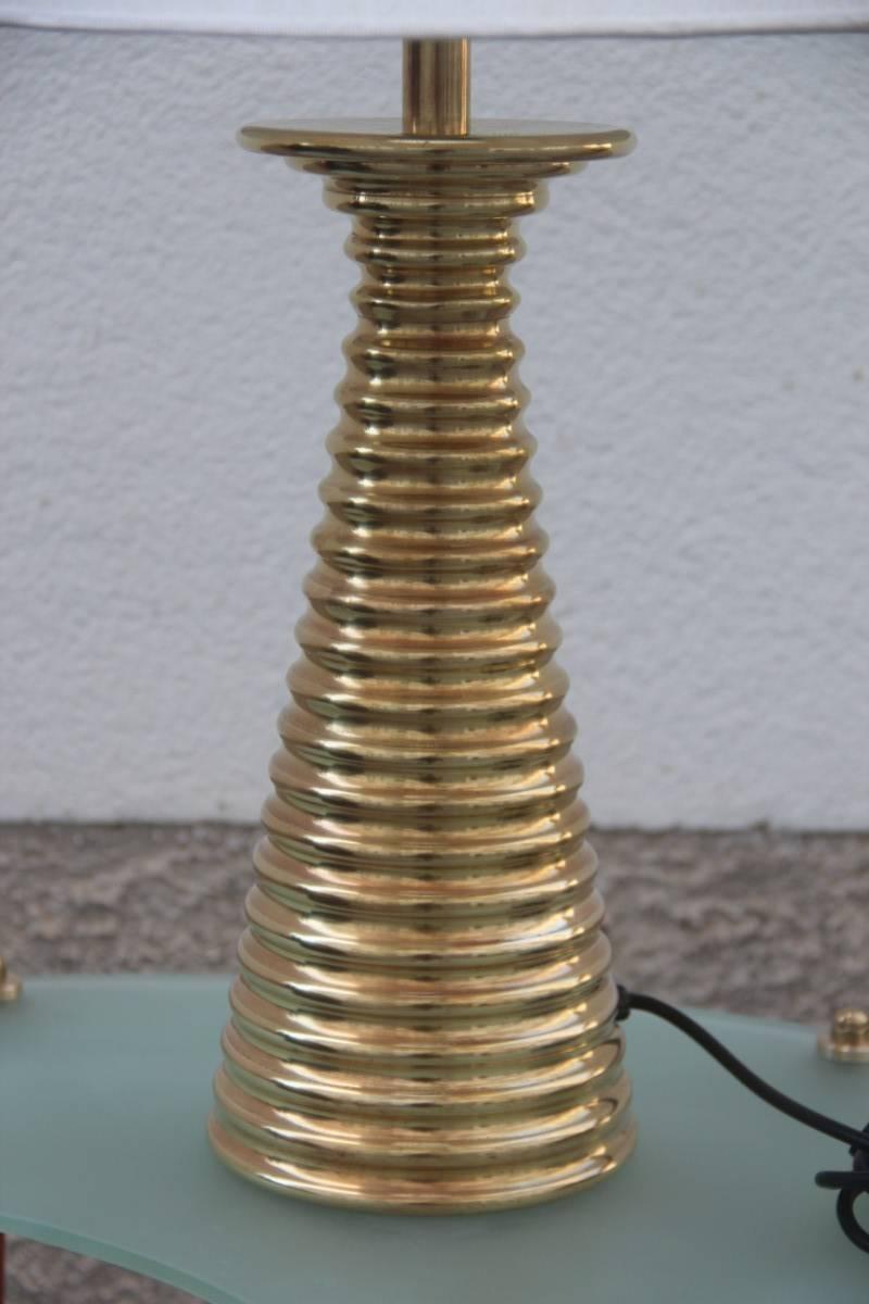 Particular and elegant Italian table lamp in 1970s brass, brass lamp height cm.42,
diameter cm.16. Fabric dome.