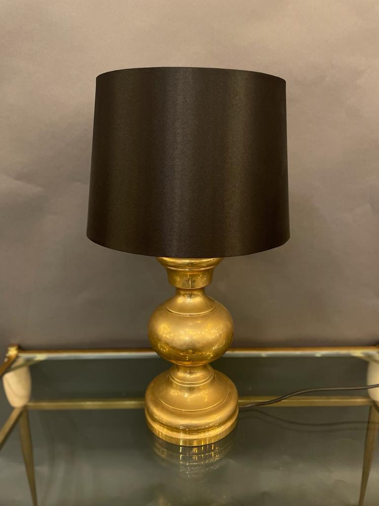 A stylish Italian table lamp in bronze, circa 1960s.